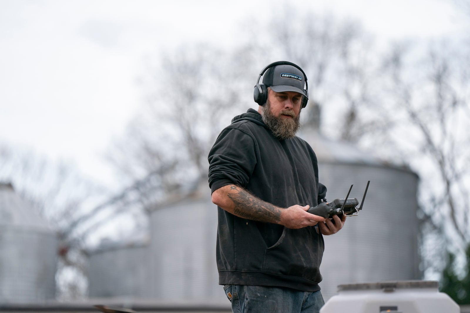 Russell Hedrick uses a DJI drone to put crop cover on his farm, Tuesday, Dec. 17, 2024, in Hickory, N.C. (AP Photo/Allison Joyce)