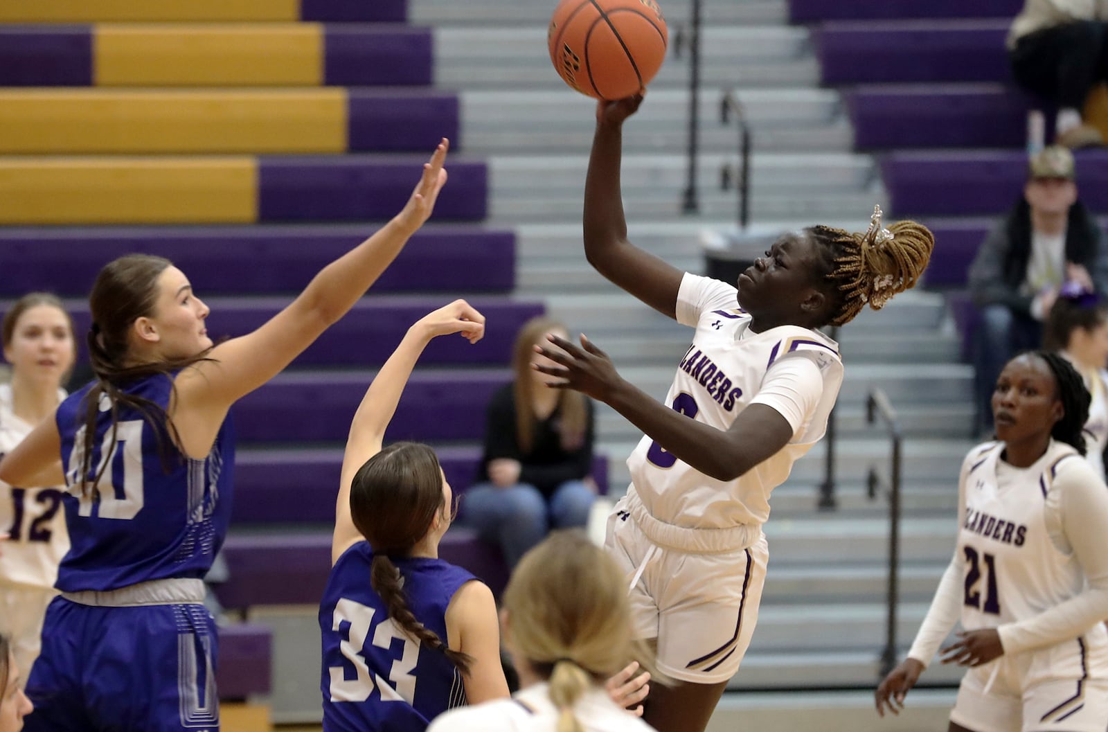 Grand Island High School's Nyaruot Wal puts up a shot over two Kearney defenders during a girls high school basketball game, Jan 4, 2024, n Grand Island, Neb. (Josh Salmon/The Independent via AP)