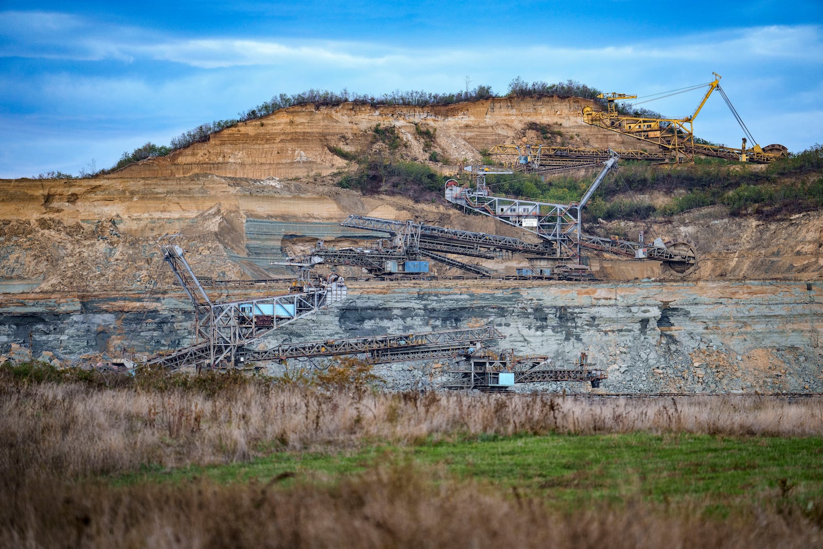 Coal extraction equipment operates at the open air quarry outside Matasari, southern Romania, Friday, Oct. 11, 2024. (AP Photo/Vadim Ghirda)