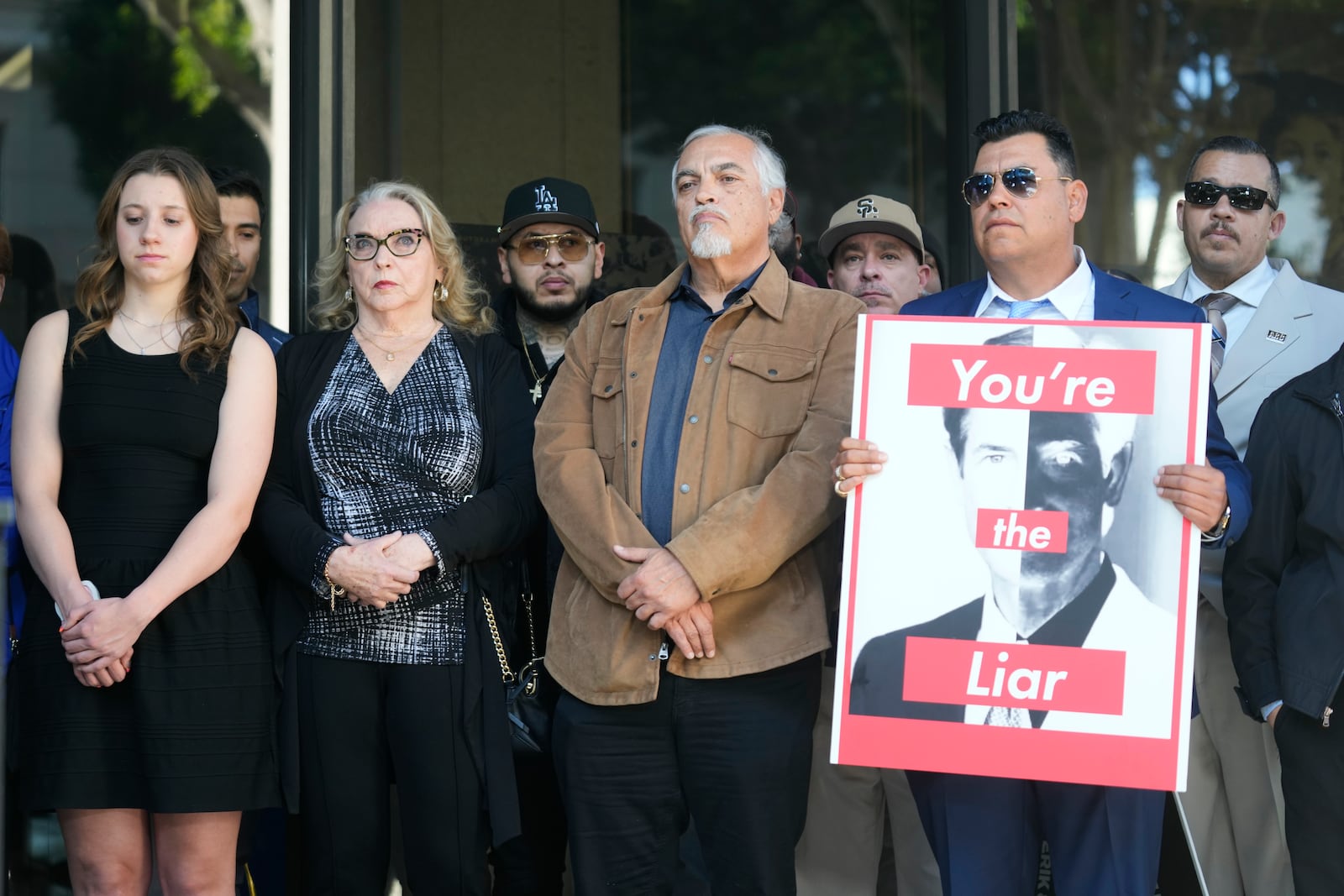 Family members and supporters stand together during a press conference regarding developments in the Menendez brothers case Thursday, March 20, 2025, in Los Angeles. (AP Photo/Damian Dovarganes)