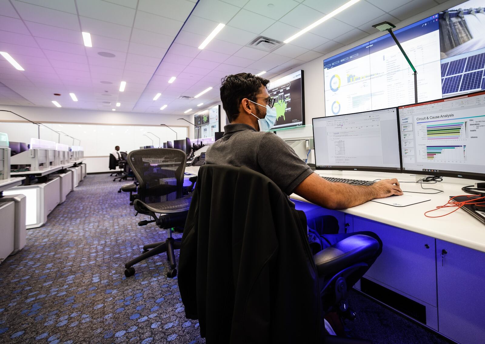 AES data scientist, Kashyap Mehta works in his new office at the newly remodeled AES smart operations center on Woodman Dr.  AES spent $20 million to renovate the old Dayton Power & Light building and move AES into the future. JIM NOELKER/STAFF