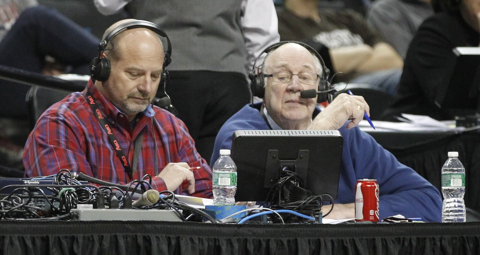 WHIO’s Larry Hansgen, left, and Bucky Bockhorn broadcast the Flyers’ victory over Fordham in the second round of the A-10 tournament on Thursday, March 13, 2014, at the Barclays Center in Brooklyn, N.Y. David Jablonski/Staff