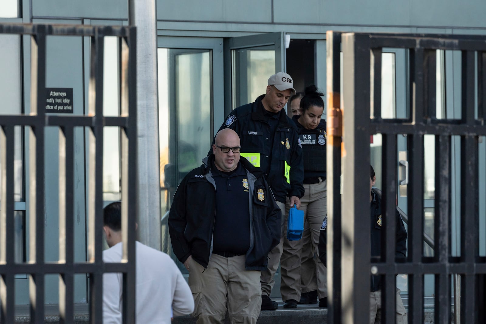 Federal enforcement officers exit the Metropolitan Detention Center, where Sean “Diddy” Combs is incarcerated, during an interagency operation, Monday, Oct. 28, 2024, in the Brooklyn Borough of New York. (AP Photo/Yuki Iwamura)