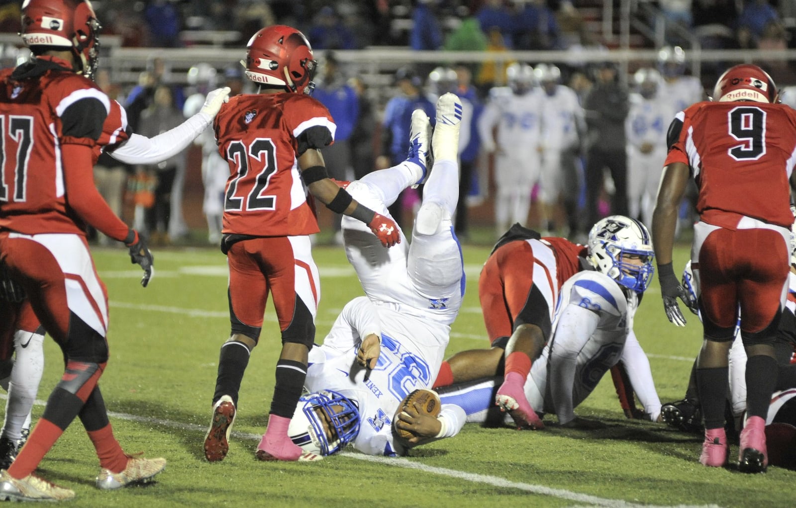 Xenia’s Sincere Wells is upended. Xenia defeated host Trotwood-Madison 29-28 in double OT in a Week 9 high school football game on Friday, Oct. 19, 2018. MARC PENDLETON / STAFF