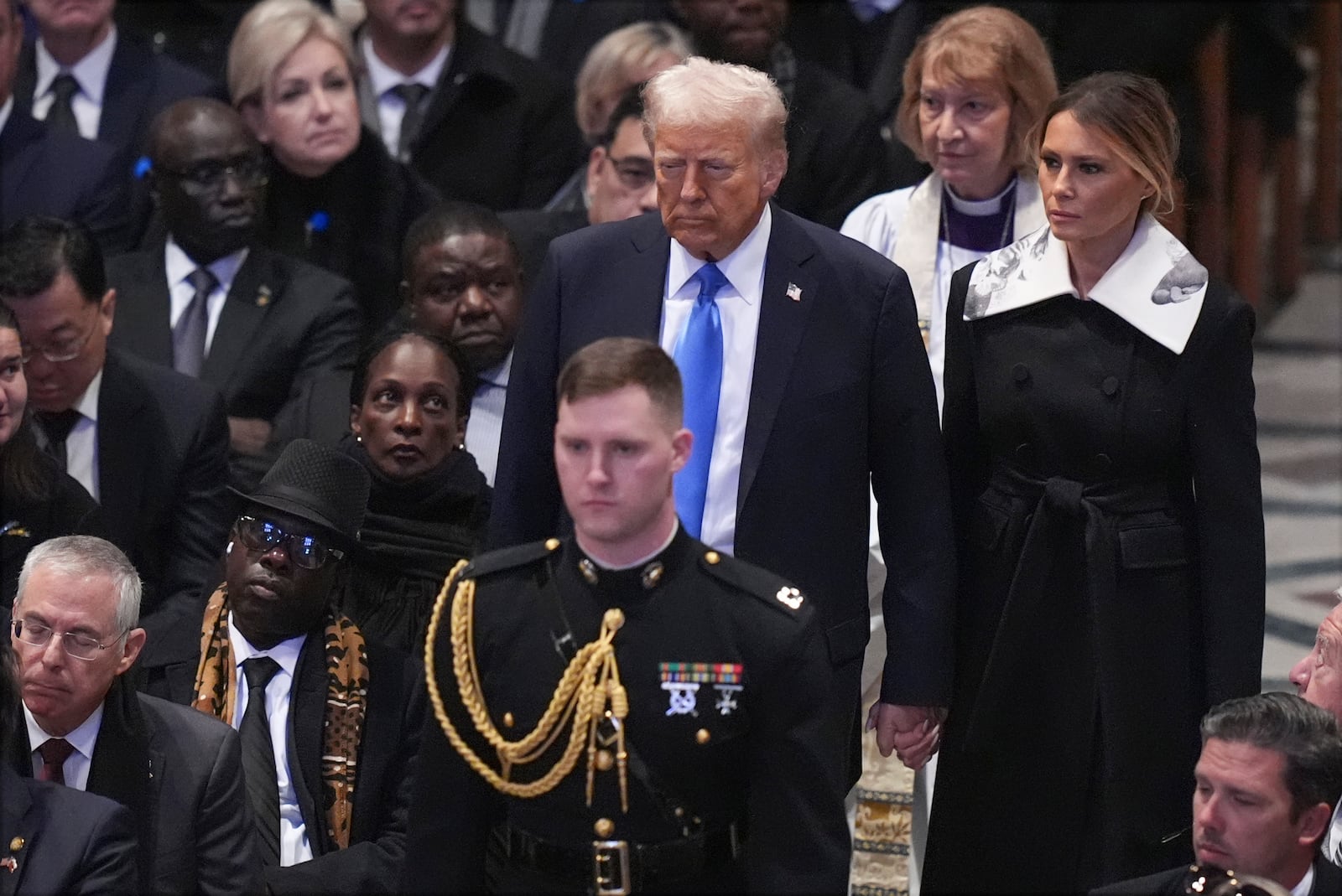 President-elect Donald Trump and Melania Trump arrive before the state funeral for former President Jimmy Carter at Washington National Cathedral in Washington, Thursday, Jan. 9, 2025. (AP Photo/Jacquelyn Martin)