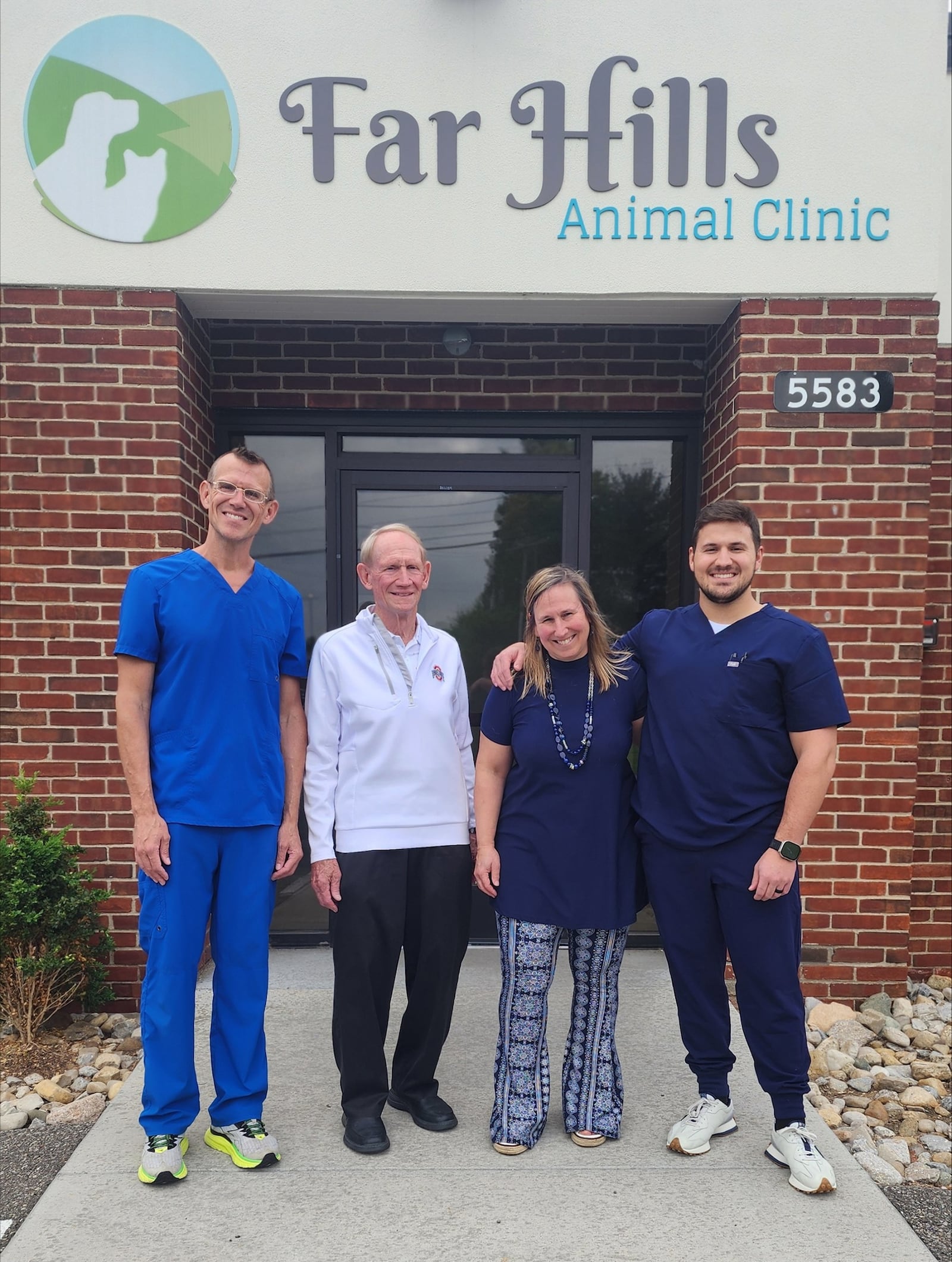 L-R Dr. Adam Coatney-Schuler, Dr. Douglas Coatney, Dr. Emily Coatney-Smith and Dr. Tyler Smith (Emily's son) in front of the Far Hills Animal Clinic last June.