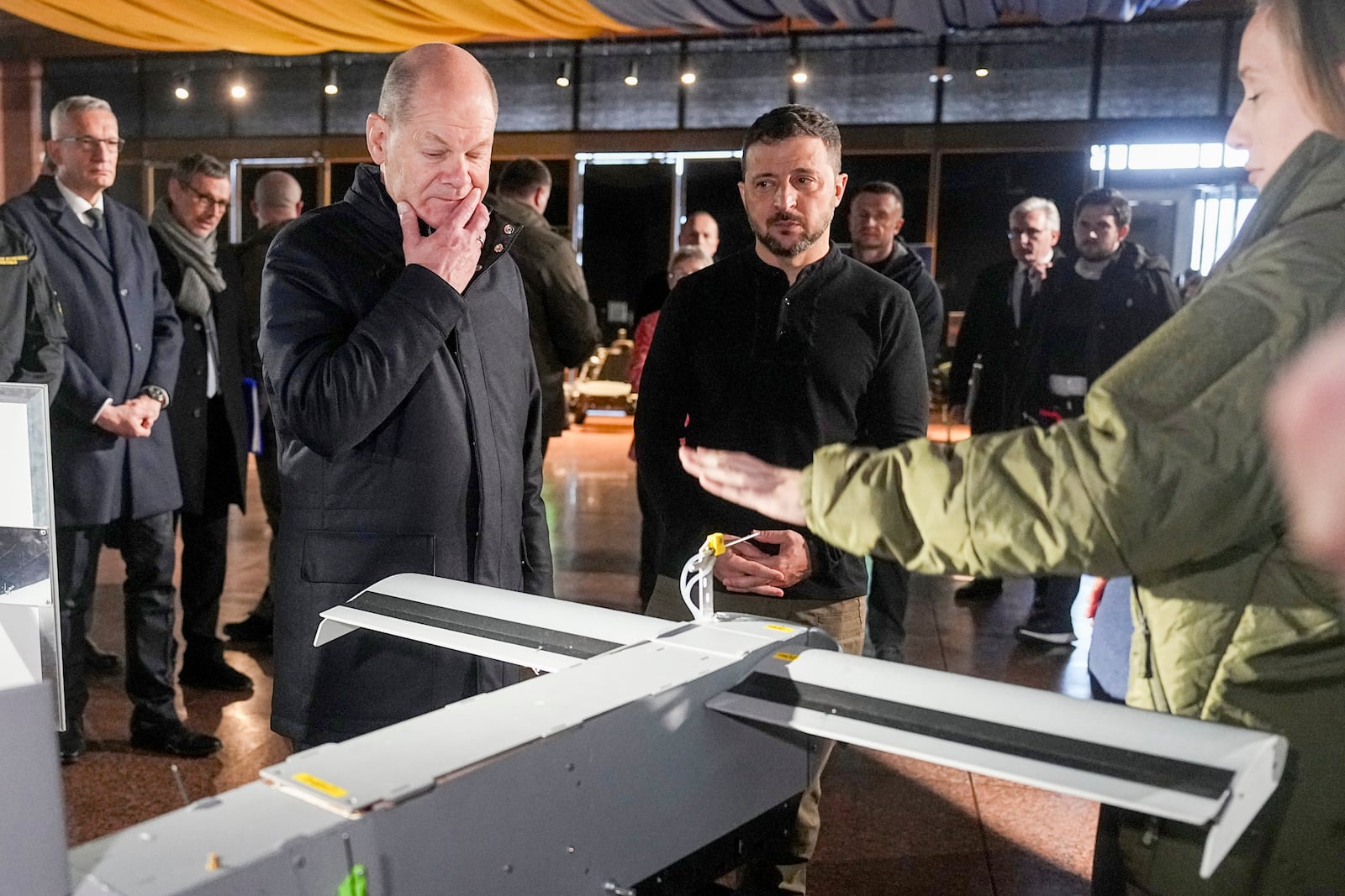 Ukraine's President Volodymyr Zelenskyy, right, and German Chancellor Olaf Scholz take a look at drones during Scholz's visit to Kyiv, Ukraine, Monday, Dec.2, 2024. (AP Photo/Efrem Lukatsky)