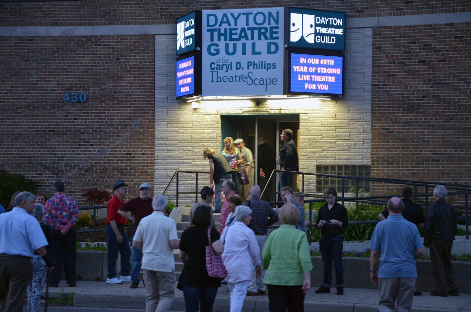 The Dayton Theatre Guild illuminates its new sign.