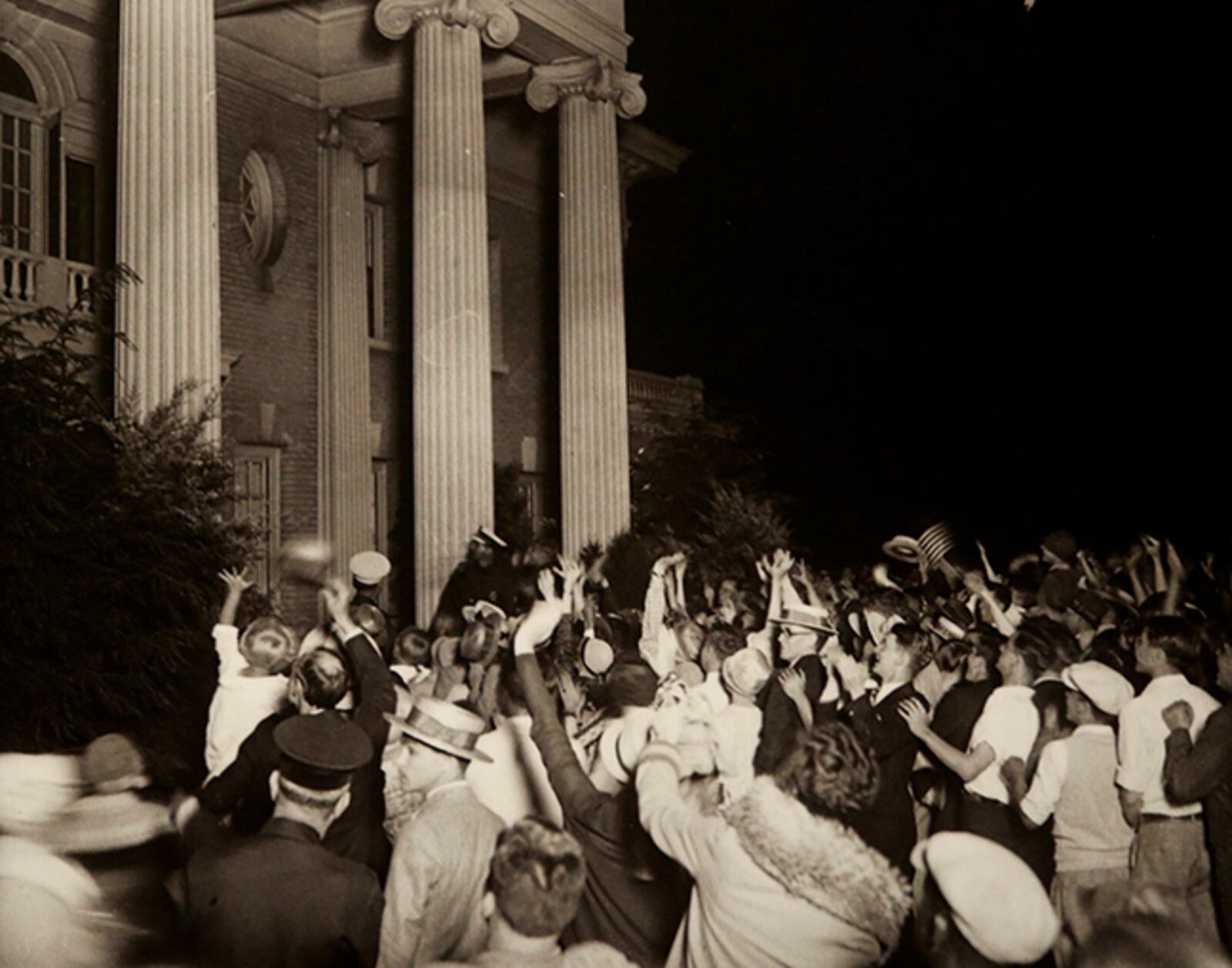 Dayton photographer William Preston Mayfield took this photograph of a crowd gathered on the lawn of Hawthorn Hill, Orville Wright's mansion, waving to famed aviator Charles Lindbergh who was on a balcony unseen in the photo. Lindbergh's visit to Wright's Oakwood mansion took place June 22, 1927, a month after his record-setting solo flight from New York to Paris. DAYTON HISTORY