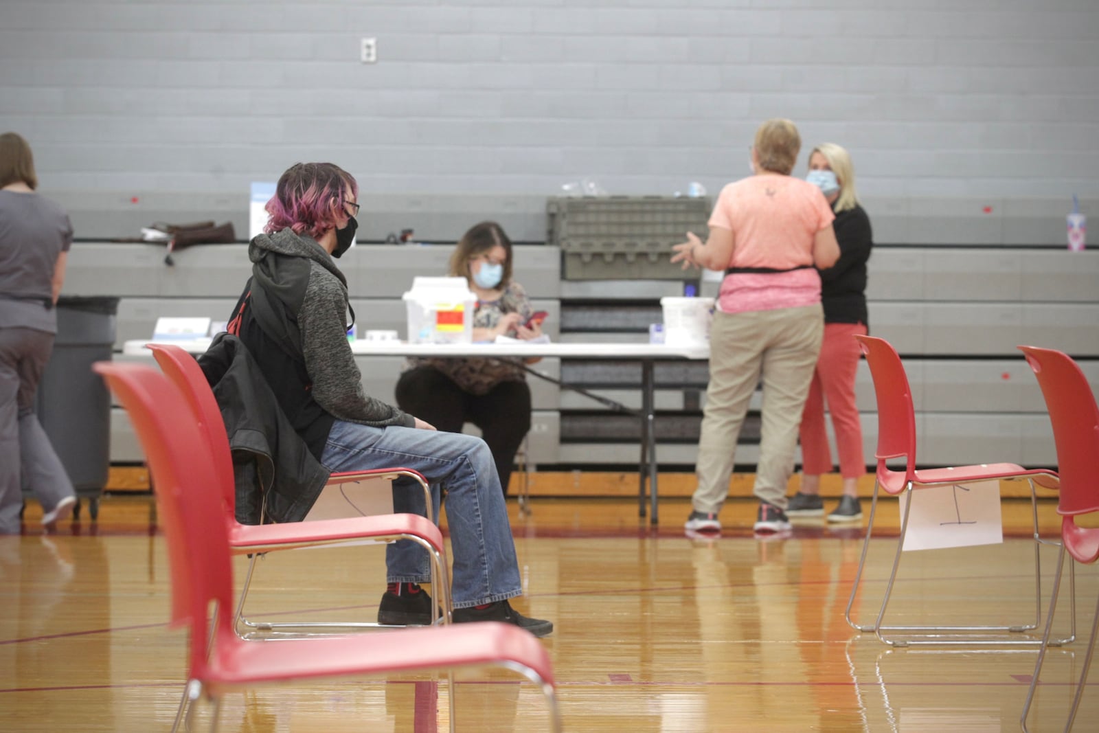 Stebbins High School sophomore, Ryan Riesenbeck waits for 15 minutes after he received a COVID-19 vaccination at the school Wednesday April 28, 2021. JIM NOELKER/STAFF