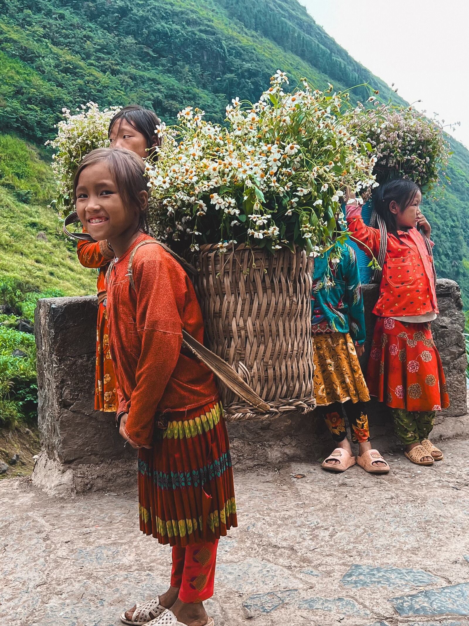 Young girls selling flowers on the Ha’ Giang Loop in Vietnam. Lesli Dean/CONTRIBUTED