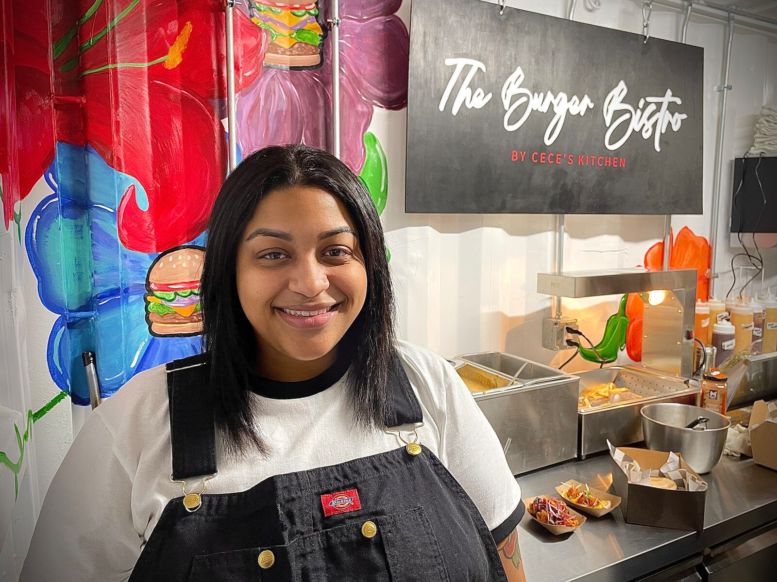 The Burger Bistro by Cece’s Kitchen is one of four vendors located inside The Silos. This restaurant offers a new spin on classic burgers and sandwiches. Pictured is Chef Centruela Collier. NATALIE JONES/STAFF