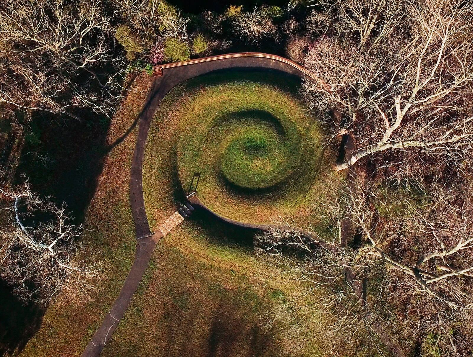 Serpent Mound's coiled tail has alignment with the summer solstice sunset.   Serpent Mound is the largest surviving ancient effigy mound in the world and is on the National Register of Historic Places.  It is located near Peebles, Ohio on State Route 73.    TY GREENLEES / STAFF