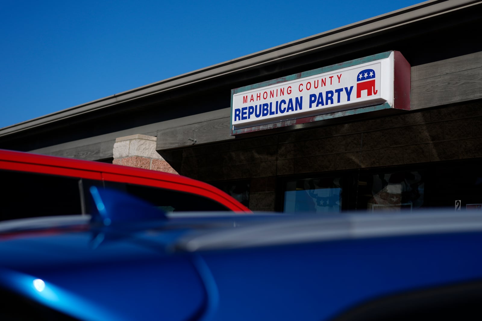 Cars are parked in front of the Mahoning County Republican Party headquarters in Boardman, Ohio, Thursday, Oct. 17, 2024. (AP Photo/Carolyn Kaster)