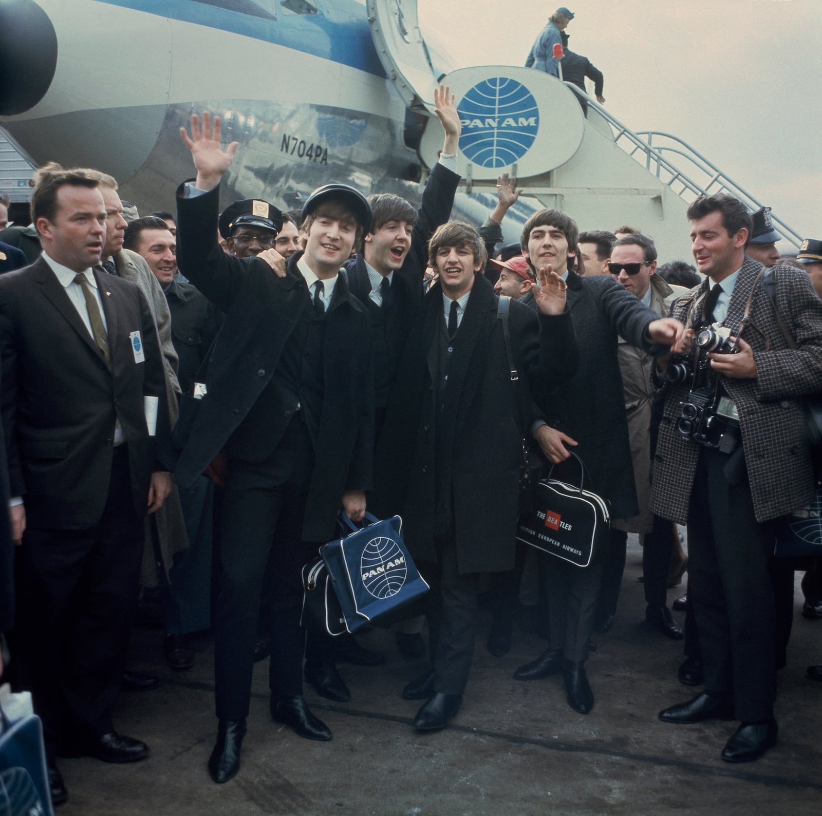 FILE - The Beatles, from left, John Lennon, Paul McCartney, Ringo Starr and George Harrison, arrive at John F. Kennedy International Airport in New York, on Feb. 7, 1964. (AP Photo, File)