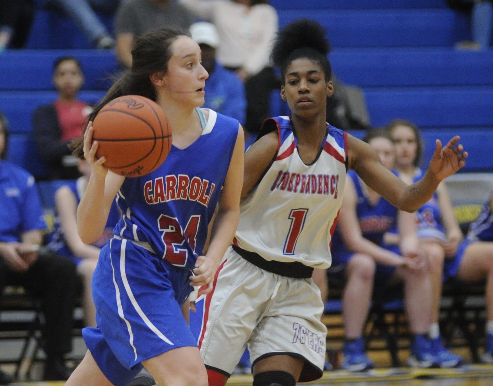 Carroll’s Allie Stefanek (left) is checked by Carlisa Strickland. Carroll defeated Columbus Independence 68-45 in a girls high school basketball D-II regional semifinal at Springfield High School on Tuesday, March 7, 2017. MARC PENDLETON / STAFF