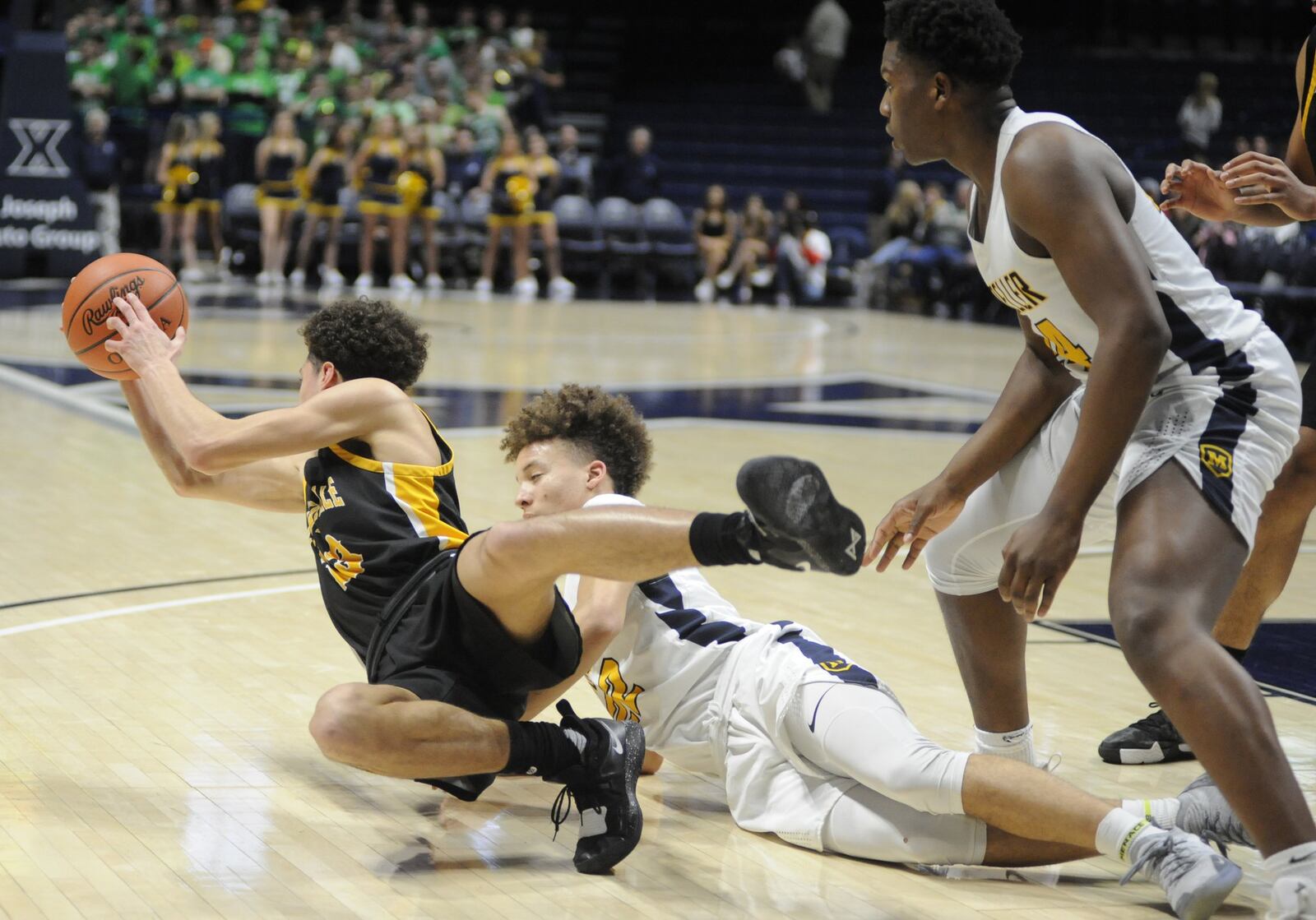 Jason Sneed of Centerville protects the ball. Moeller defeated Centerville 59-41 in a boys high school basketball D-I regional final at Xavier University’s Cintas Center on Saturday, March 16, 2019. MARC PENDLETON / STAFF