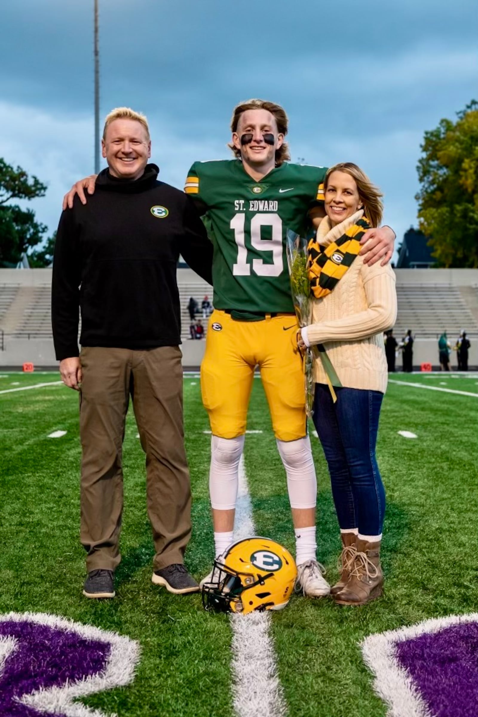 Ben Lavelle, when he starred at Lakewood St. Edward, flanked by dad Brian and mom Julie. CONTRIBUTED