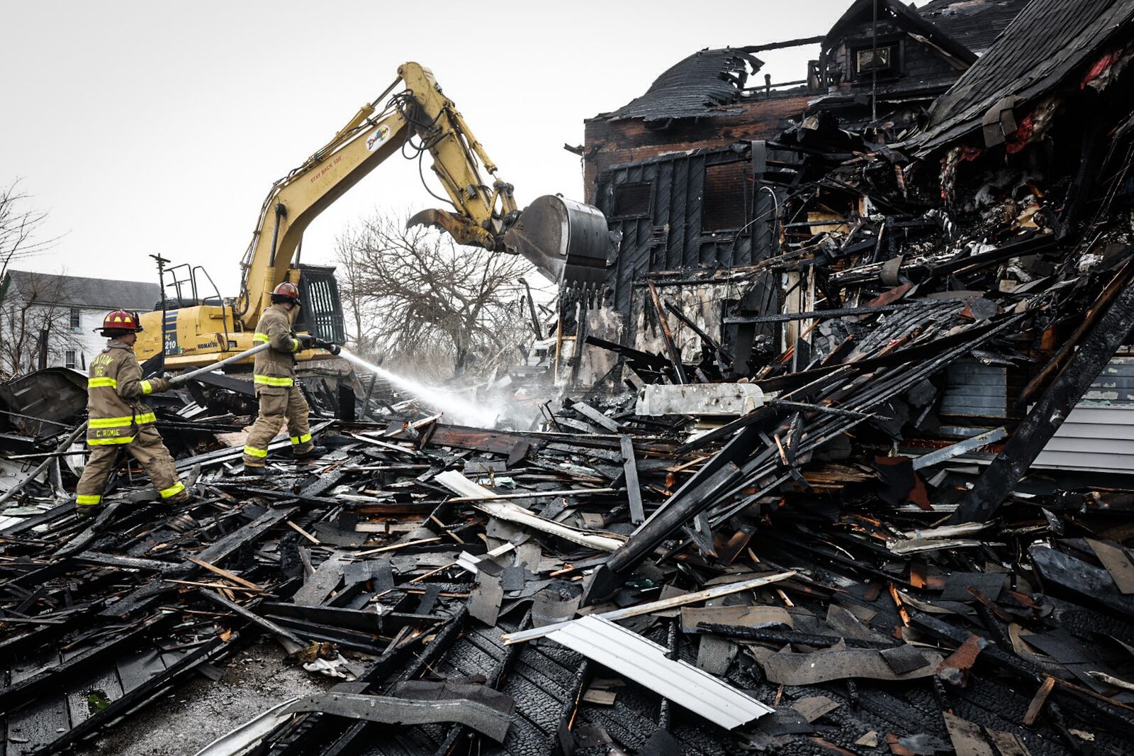 The bodies of five people were discovered in heavy debris in the aftermath of a large fire Wednesday morning, March 8, 2023, at a vacant house in the 500 block of North Broadway Street in Dayton. Crews ordered emergency demolition of two houses destroyed in the fire. A third house was damaged in the massive blaze. JIM NOELKER/STAFF