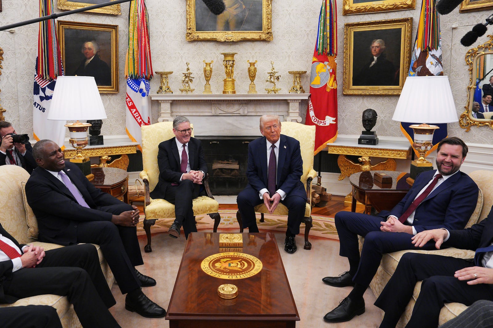 President Donald Trump meets with British Prime Minister Keir Starmer, center left, alongside U.S. Vice President JD Vance, right, and British Foreign Secretary David Lammy, left, at the White House, Thursday, Feb. 27, 2025, in Washington. (Carl Court/Pool via AP)