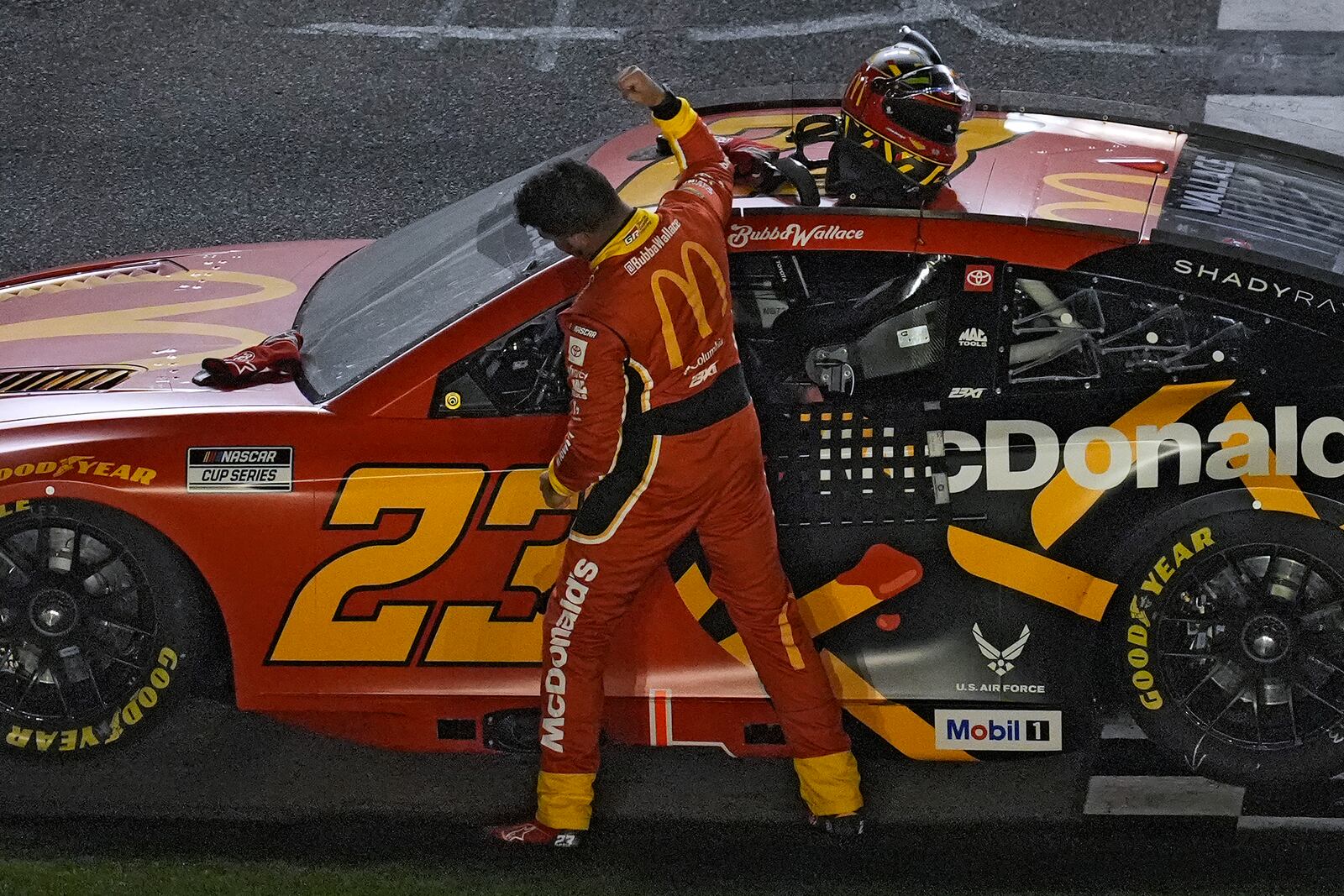 Bubba Wallace celebrates his win during the first of two NASCAR Daytona 500 qualifying auto races Thursday, Feb. 13, 2025, at Daytona International Speedway in Daytona Beach, Fla. (AP Photo/Chris O'Meara)