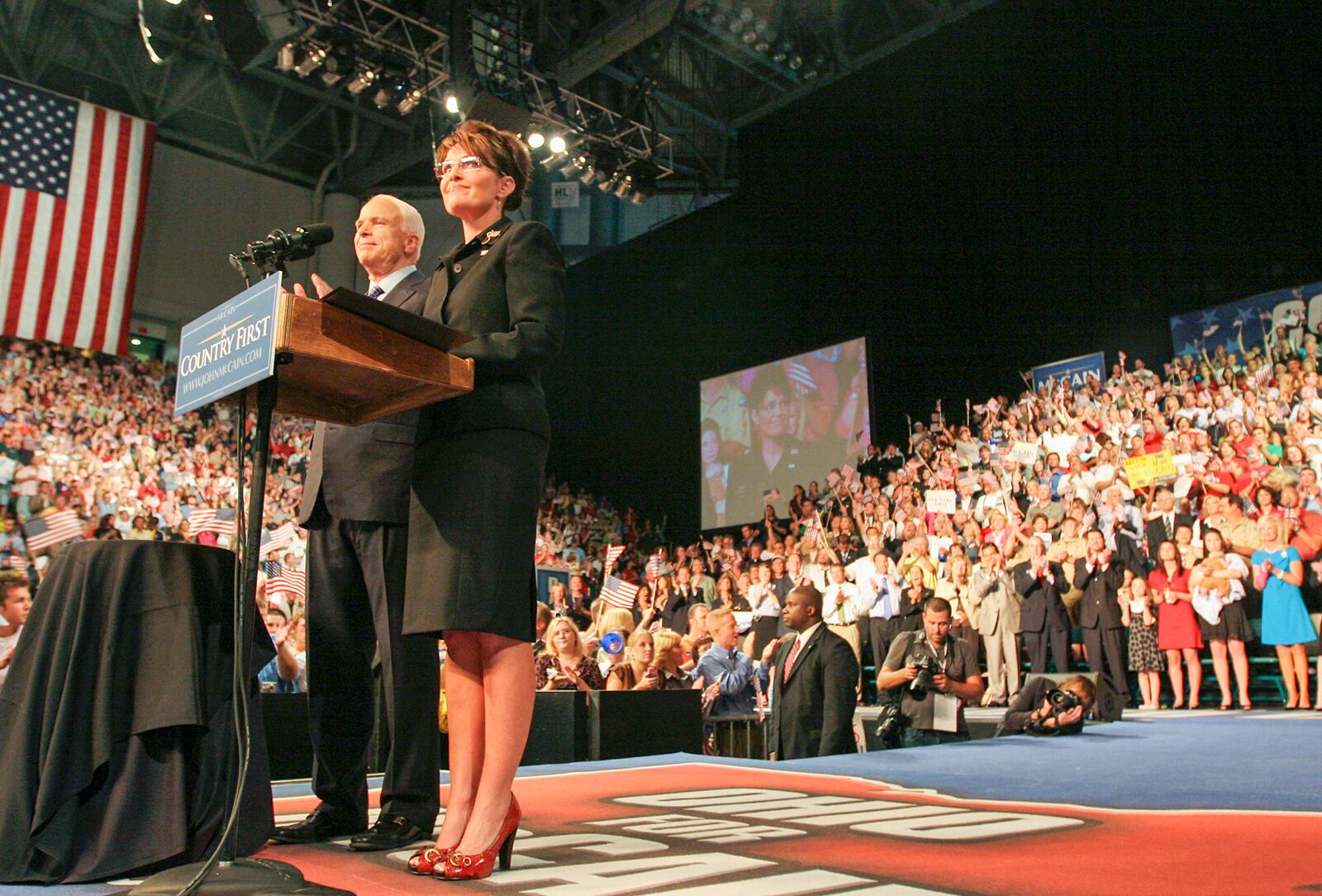 John McCain and his just-named vice presidential selection, Alaska Gov. Sarah Palin stand together at the podium before the crowd on Friday, Aug. 29, 2008, at the Nutter Center in Fairborn, Ohio. Staff photo by Jim Witmer