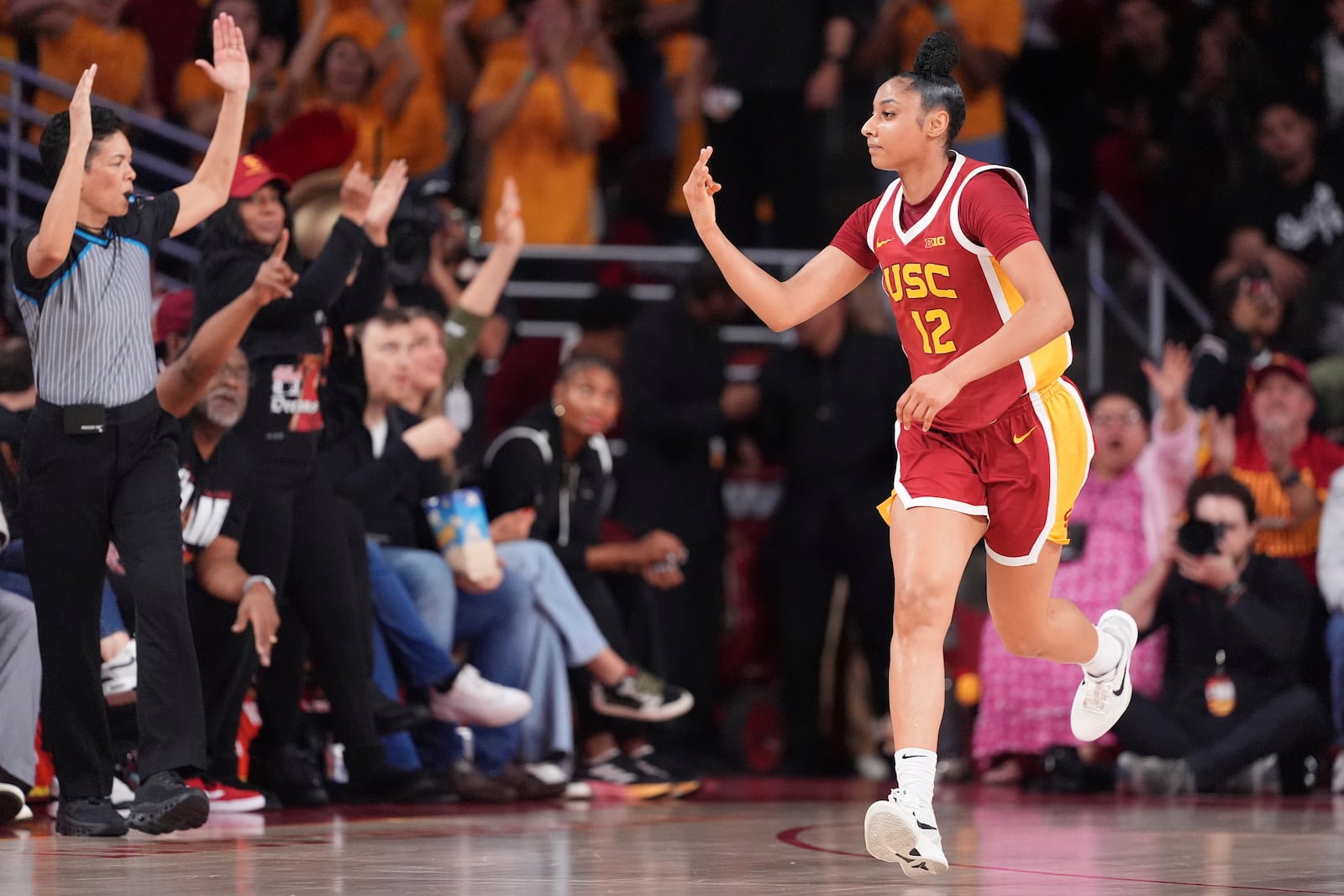 Southern California guard JuJu Watkins gestures after scoring during the first half of an NCAA college basketball game against the UCLA, Thursday, Feb. 13, 2025, in Los Angeles. (AP Photo/Mark J. Terrill)