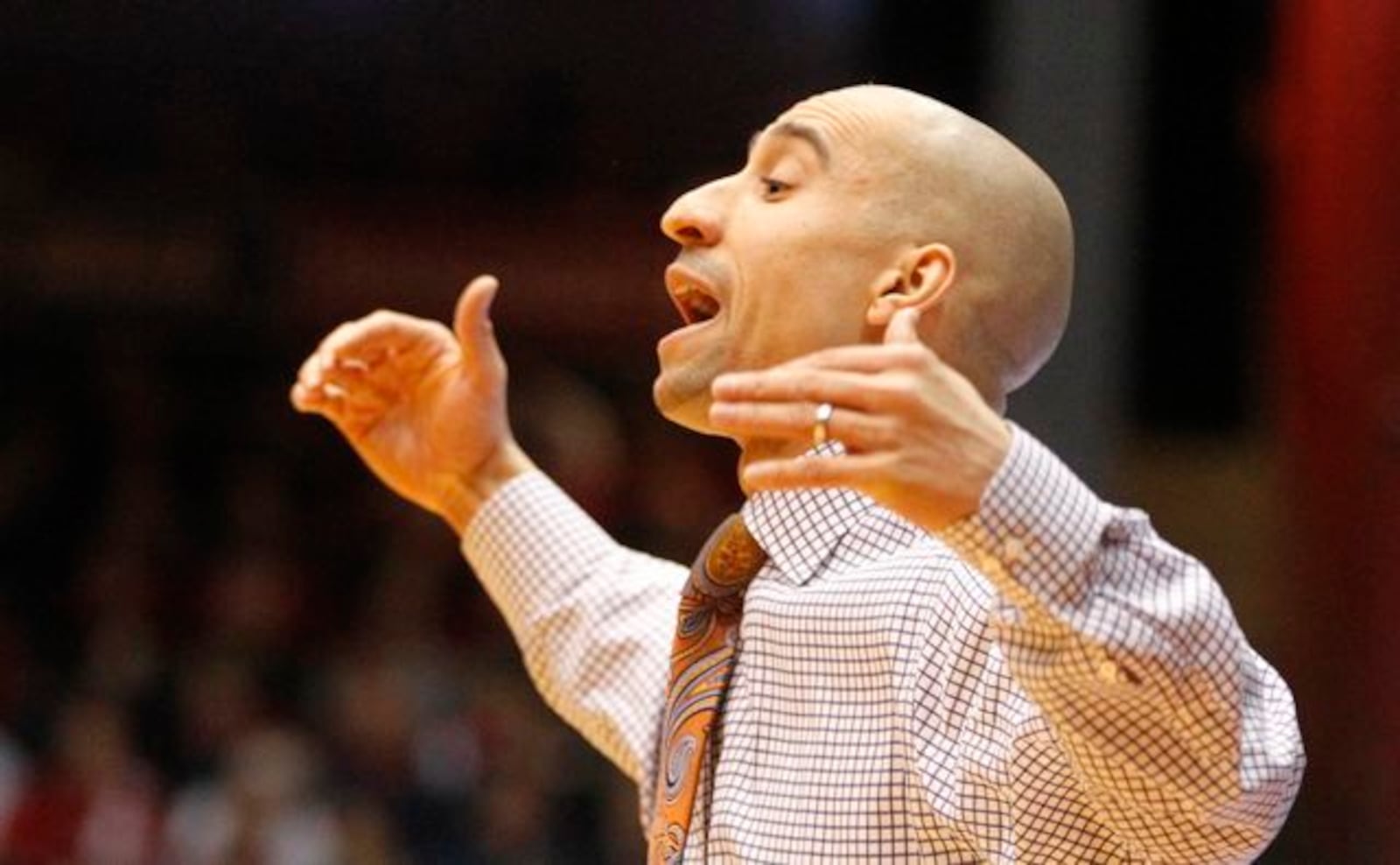 Virginia Commonwealth coach Shaka Smart talks to his team during a game against Dayton on Wednesday, Jan. 22, 2014, at UD Arena.