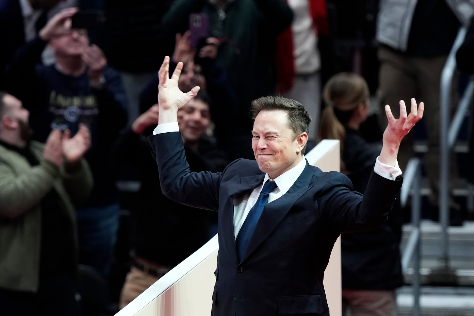 Elon Musk arrives on stage to speak at an indoor Presidential Inauguration parade event in Washington, Monday, Jan. 20, 2025. (AP Photo/Susan Walsh)