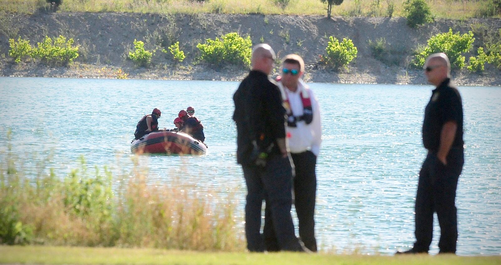 Rescue crews from Dayton, Piqua and Wright Patterson Air Force Base search a lake near Action Sports Monday, July 1, 2024 in Dayton. A swimmer was seen struggling in the water Sunday evening. MARSHALL GORBY\STAFF