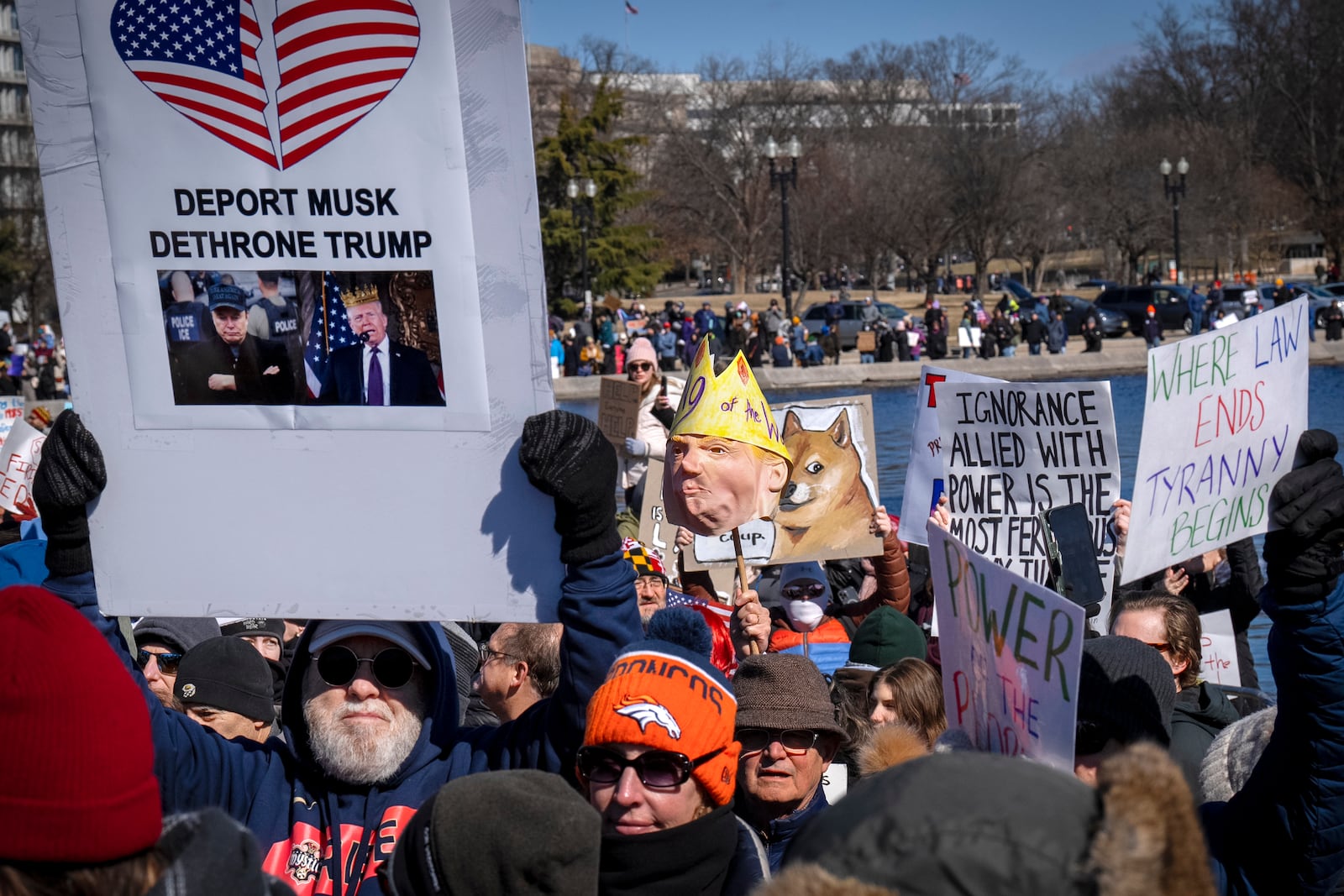 People take part in the "No Kings Day" protest on Presidents Day in Washington, in support of federal workers and against recent actions by President Donald Trump and Elon Musk, Monday, Feb. 17, 2025, at the reflecting pool by the Capitol in Washington. The protest was organized by the 50501 Movement, which stands for 50 Protests 50 States 1 Movement. (AP Photo/Jacquelyn Martin)