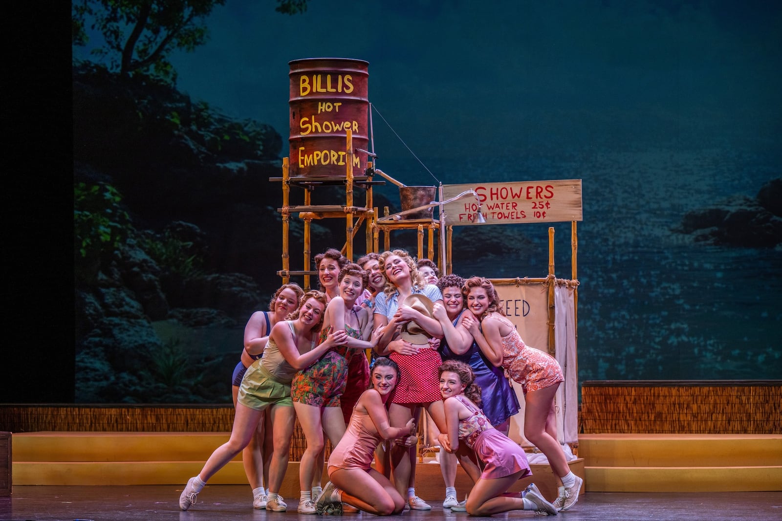 Robin Dunavant (center as Nellie Forbush) and the female ensemble sing "A Wonderful Guy" in Dayton Performing Arts Alliance and Wright State University's collaborative presentation of "South Pacific." PHOTO BY SCOTT ROBBINS