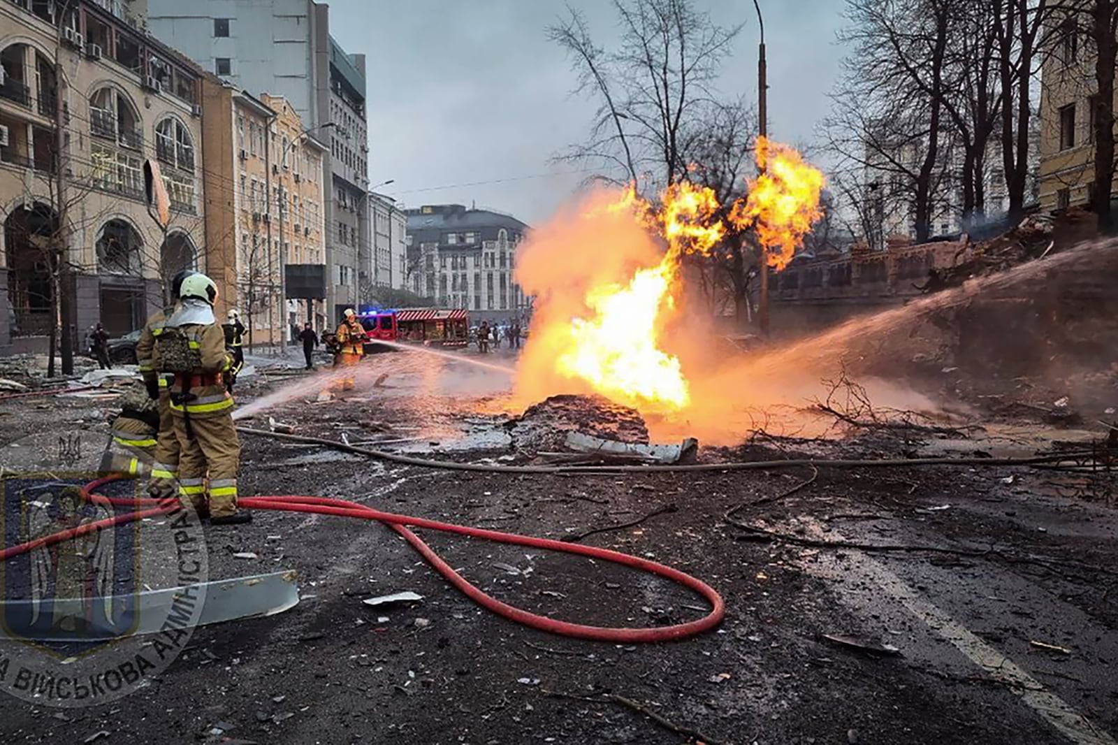 In this photo provided by Kyiv city's military administration, firefighters work on the site after a Russian missile attack in Kyiv, Ukraine, Friday, Dec. 20, 2024. (Kyiv city's military administration via AP)