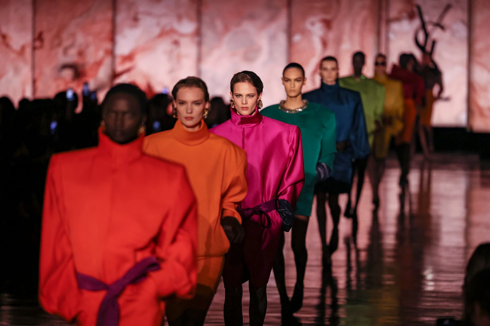 Models wear creations as part of the Saint Laurent Fall/Winter 2025-2026 Womenswear collection presented Tuesday, March 11, 2025. in Paris. (AP Photo/Thomas Padilla)