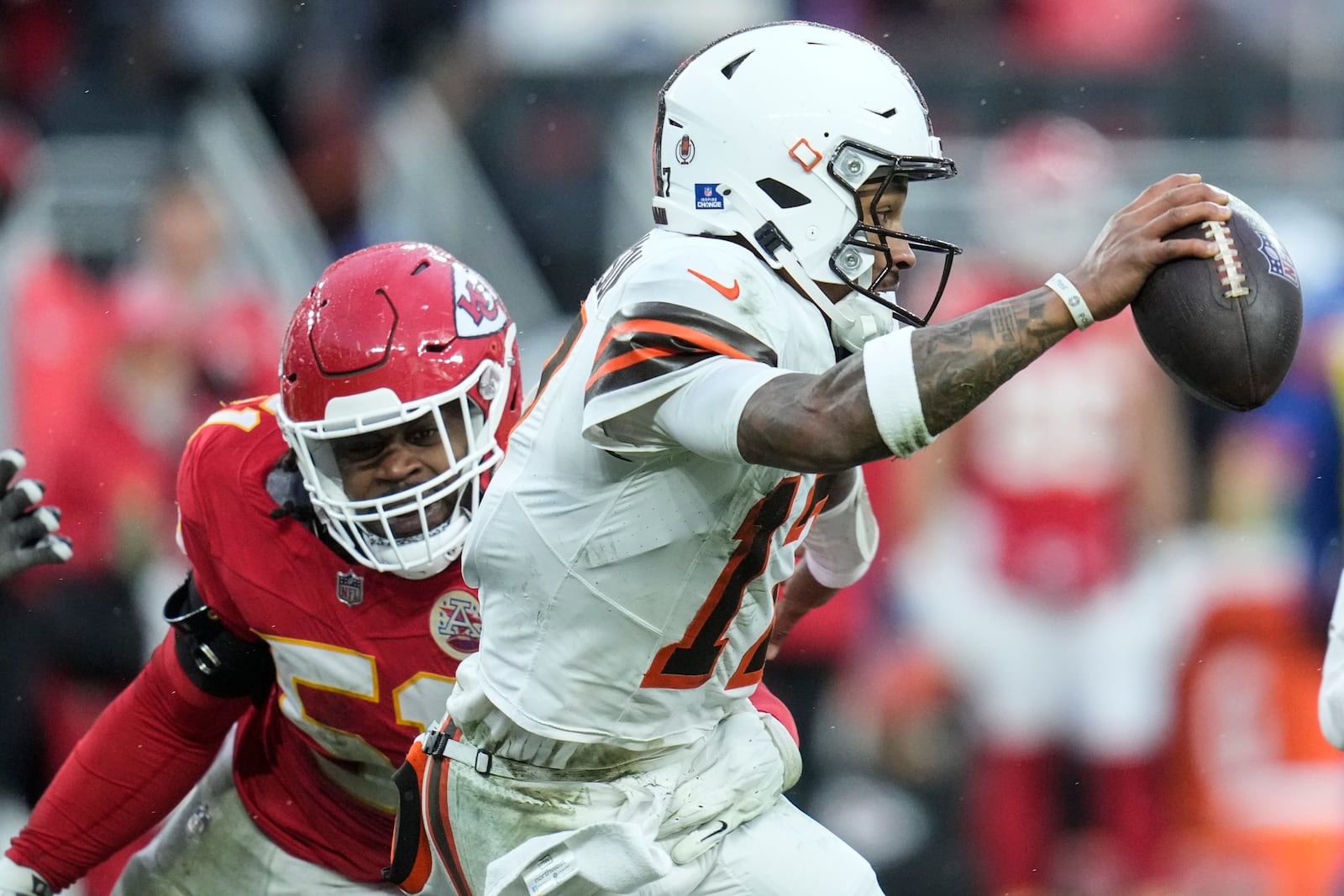 Kansas City Chiefs defensive end Mike Danna (51) pursues Cleveland Browns quarterback Dorian Thompson-Robinson (17) during the second half of an NFL football game, Sunday, Dec. 15, 2024, in Cleveland. (AP Photo/Sue Ogrocki)