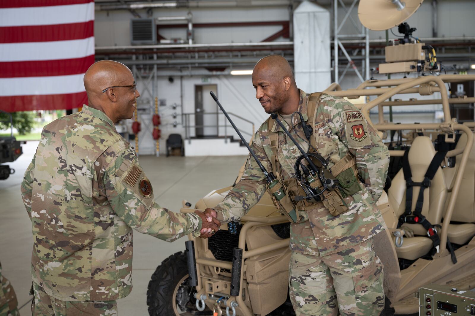 Air Force Chief of Staff Gen. CQ Brown, Jr., talks with Staff Sgt. Sean Scott, 1st Combat Communications Squadron landing zone safety officer, at a capabilities display during his visit to Ramstein Air Base, Germany, July 15, 2021. Brown took the time to meet with Airmen and get a first-hand look at Ramstein AB’s unique capabilities after delivering a message of collective defense and airpower to allies and partners at the inaugural Chief of the Air Staff’s Global Air Chiefs’ Conference. U.S. Air Force photo by Senior Airman John R. Wright