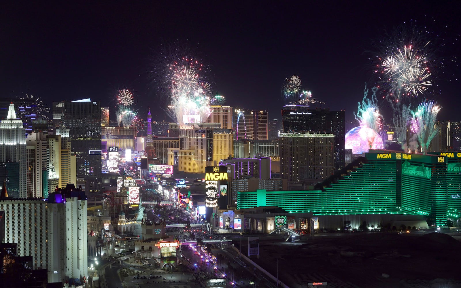 Fireworks celebrating the new year explode over Las Vegas Strip casinos just after midnight Wednesday, Jan. 1, 2025, in Las Vegas. (Steve Marcus/Las Vegas Sun via AP)