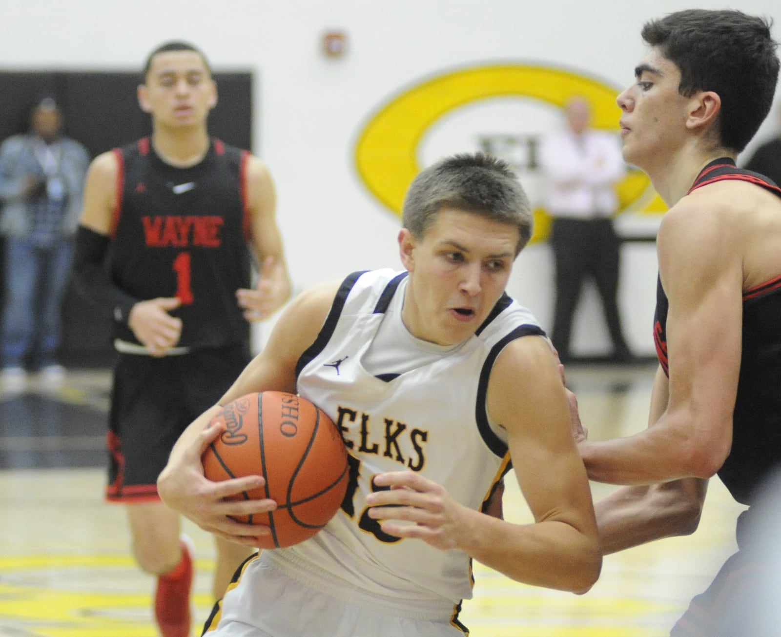 Ryan Ballard of Centerville (with ball) takes on Bobby Cole of Wayne. Centerville defeated visiting Wayne 69-44 in a boys high school basketball game on Friday, Feb. 15, 2019. MARC PENDLETON / STAFF