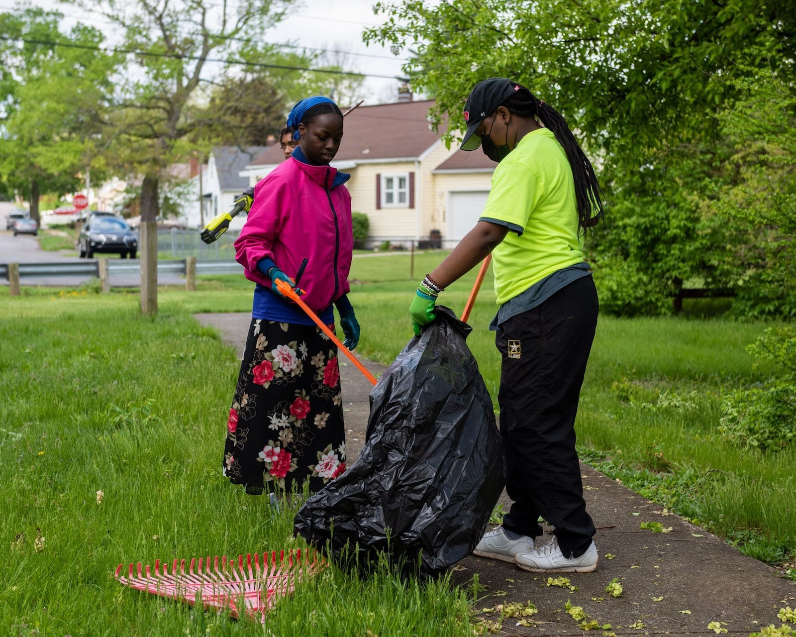 Volunteers help clean up Dayton neighborhoods during the 2023 edition of the Living City Project. PHOTO/JUSTIN SPIVEY