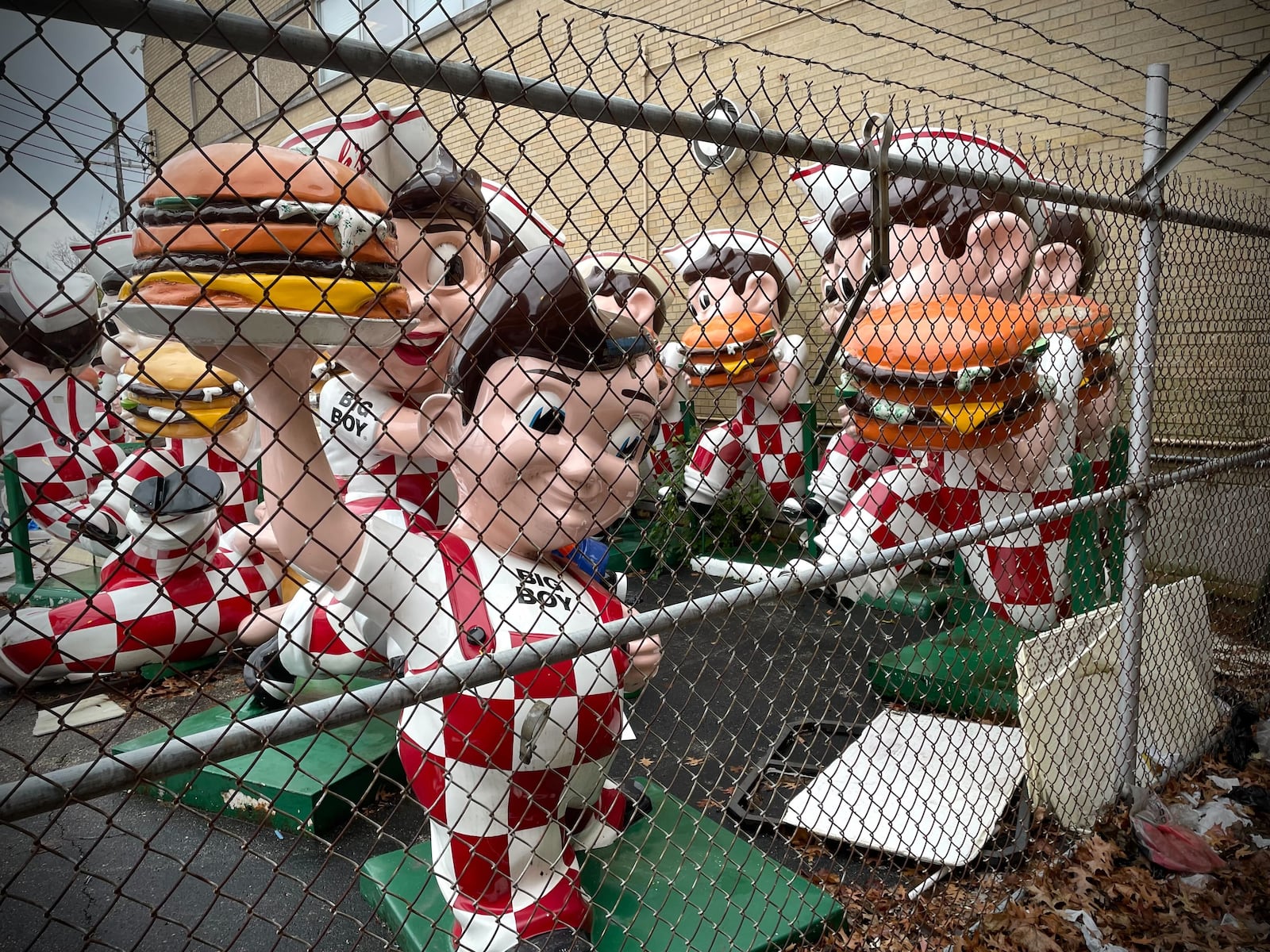 More than 20 iconic Frisch's Big Boy statues can be found in a gated area dubbed on social media as the “Big Boy Graveyard” in Cincinnati. NATALIE JONES/STAFF