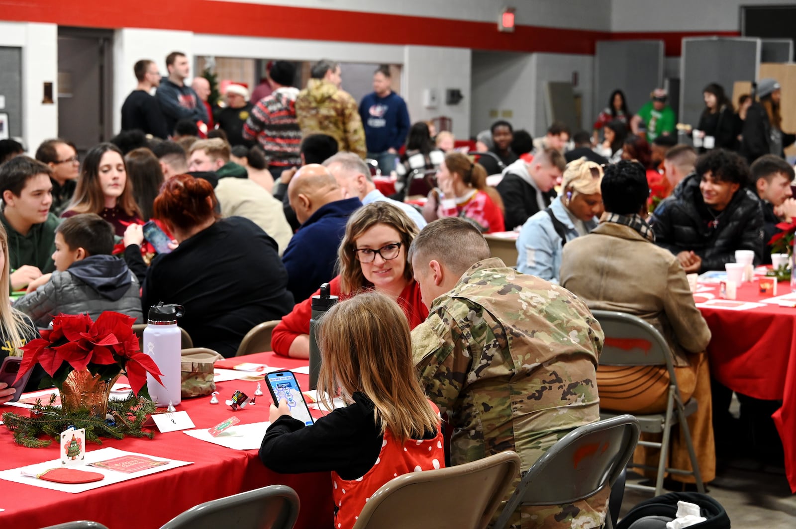 Soldiers and the family members of the  237th BSB Delta Company and HHT 2nd 107th Calvary Squadron celebrated Christmas at the Charles H. Jones National Guard Armory on Symmes Road in Hamilton. MICHAEL D. PITMAN/STAFF