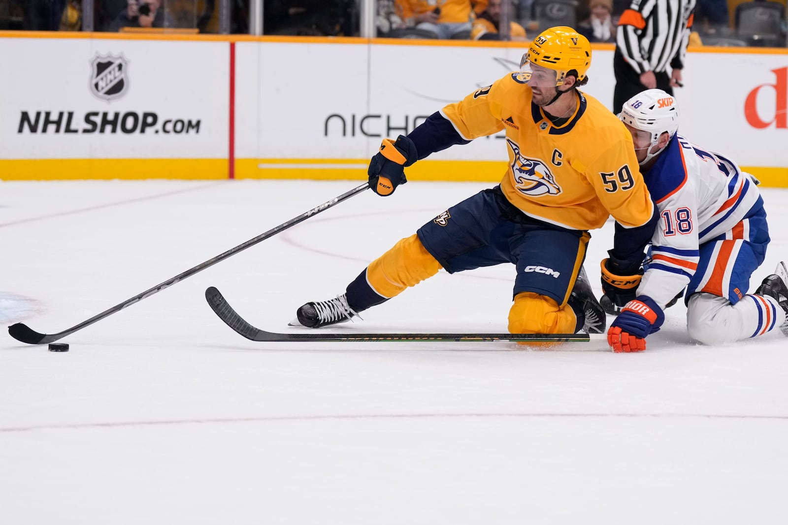 Nashville Predators defenseman Roman Josi (59) chases the past Edmonton Oilers left wing Zach Hyman (18) during the third period of an NHL hockey game Thursday, Oct. 17, 2024, in Nashville, Tenn. (AP Photo/George Walker IV)