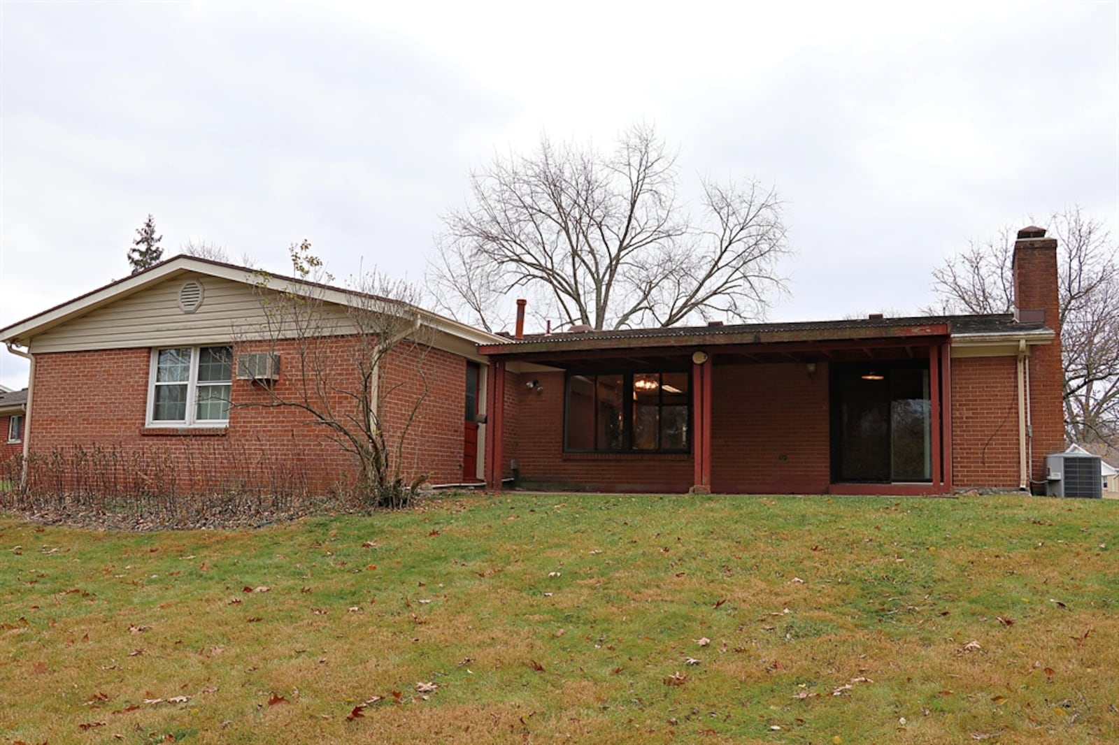 The semi-private property has a covered backyard patio.