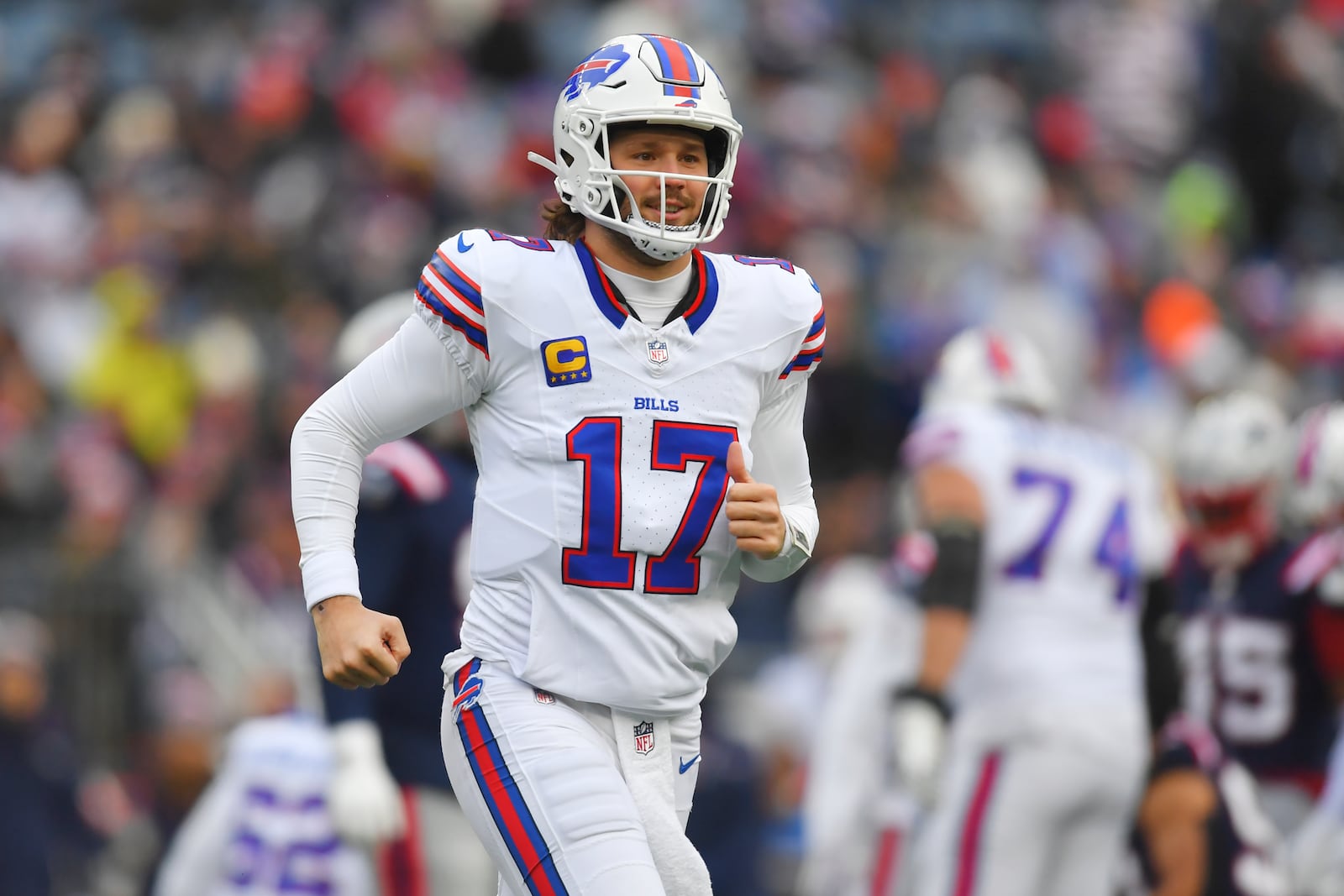 Buffalo Bills quarterback Josh Allen (17) smiles while coming out of the game during the first half of an NFL football game against the New England Patriots, Sunday, Jan. 5, 2025, in Foxborough, Mass. (AP Photo/Steven Senne)