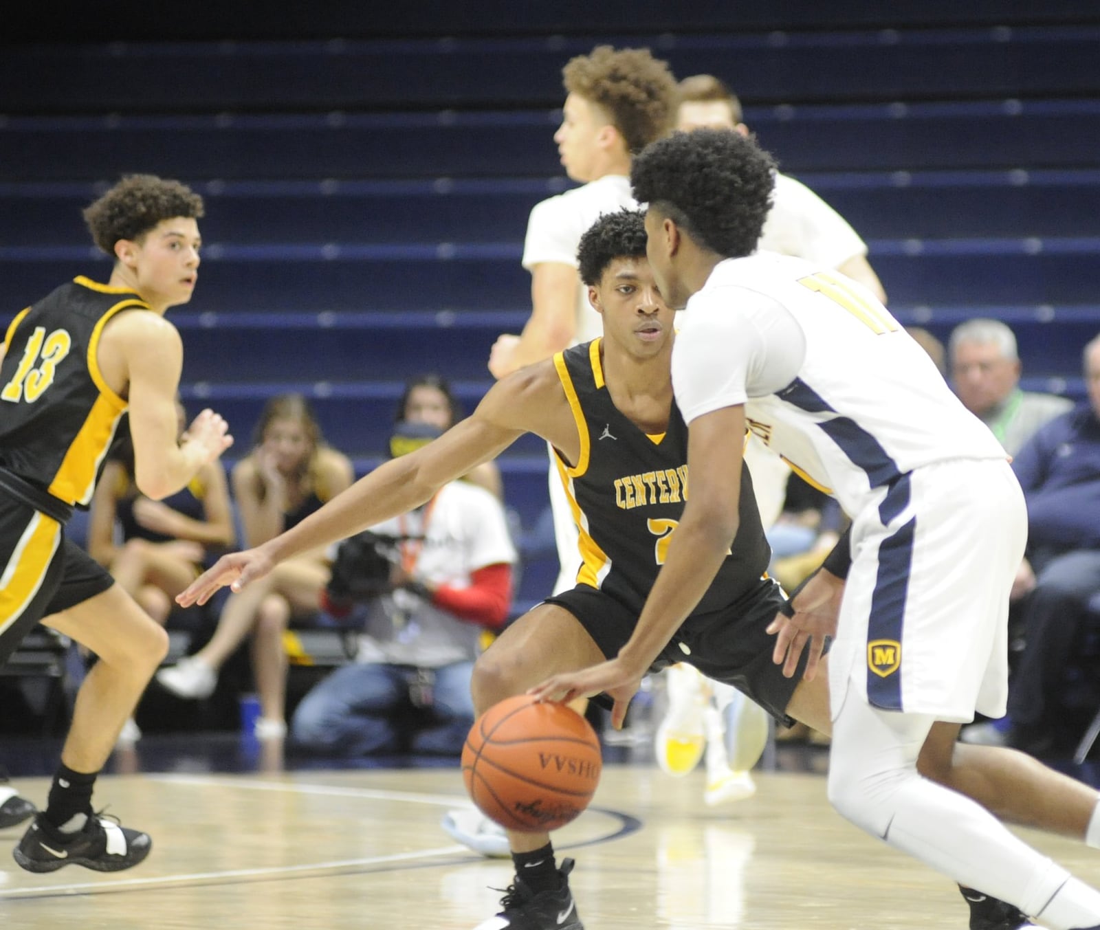 Kaleb Mitchell of Centerville gets defensive with Miles McBride. Moeller defeated Centerville 59-41 in a boys high school basketball D-I regional final at Xavier University’s Cintas Center on Saturday, March 16, 2019. MARC PENDLETON / STAFF