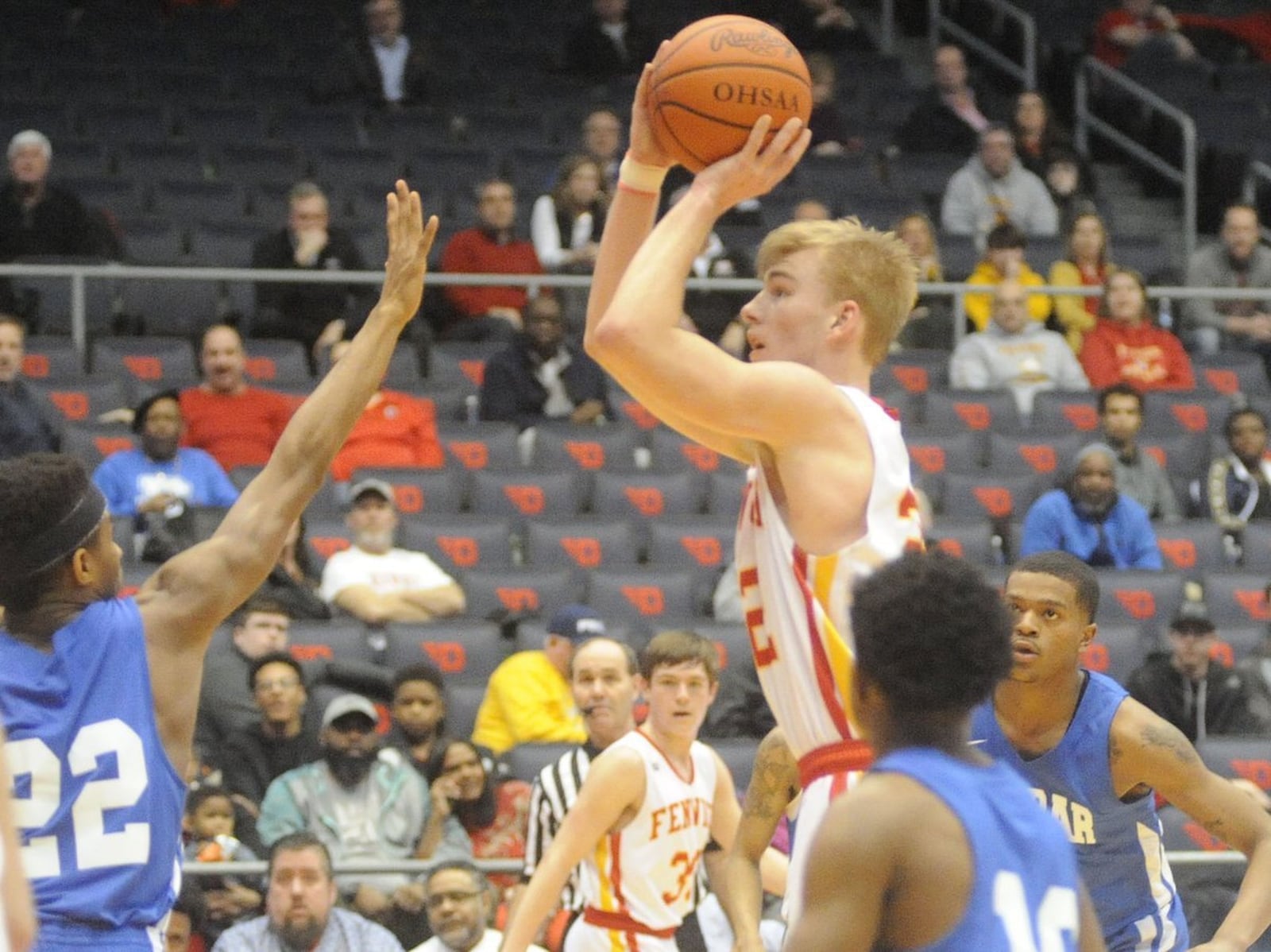 Fenwick’s C.J. Napier puts up a shot over Dunbar’s DaShaun Huffman (22) on March 7 during a Division II sectional final at the University of Dayton Arena. MARC PENDLETON/STAFF