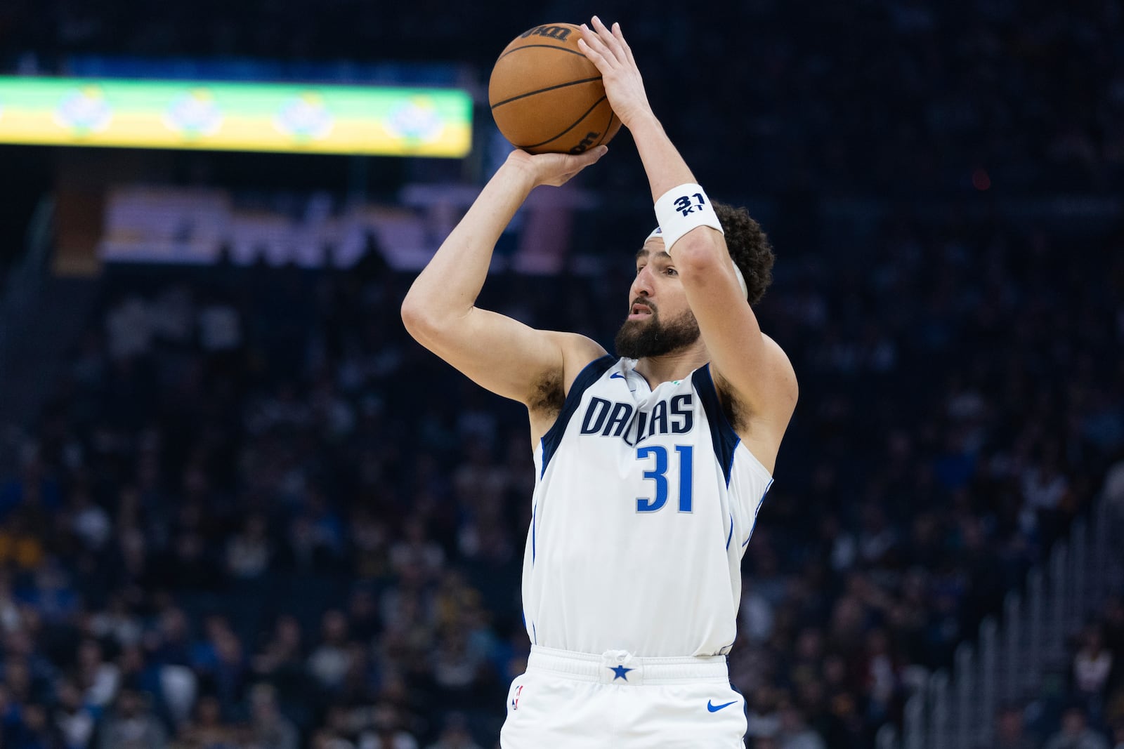 Dallas Mavericks guard Klay Thompson looks to shoot during the first half of an NBA basketball game against the Golden State Warriors, Sunday, Dec. 15, 2024, in San Francisco. (AP Photo/Benjamin Fanjoy)