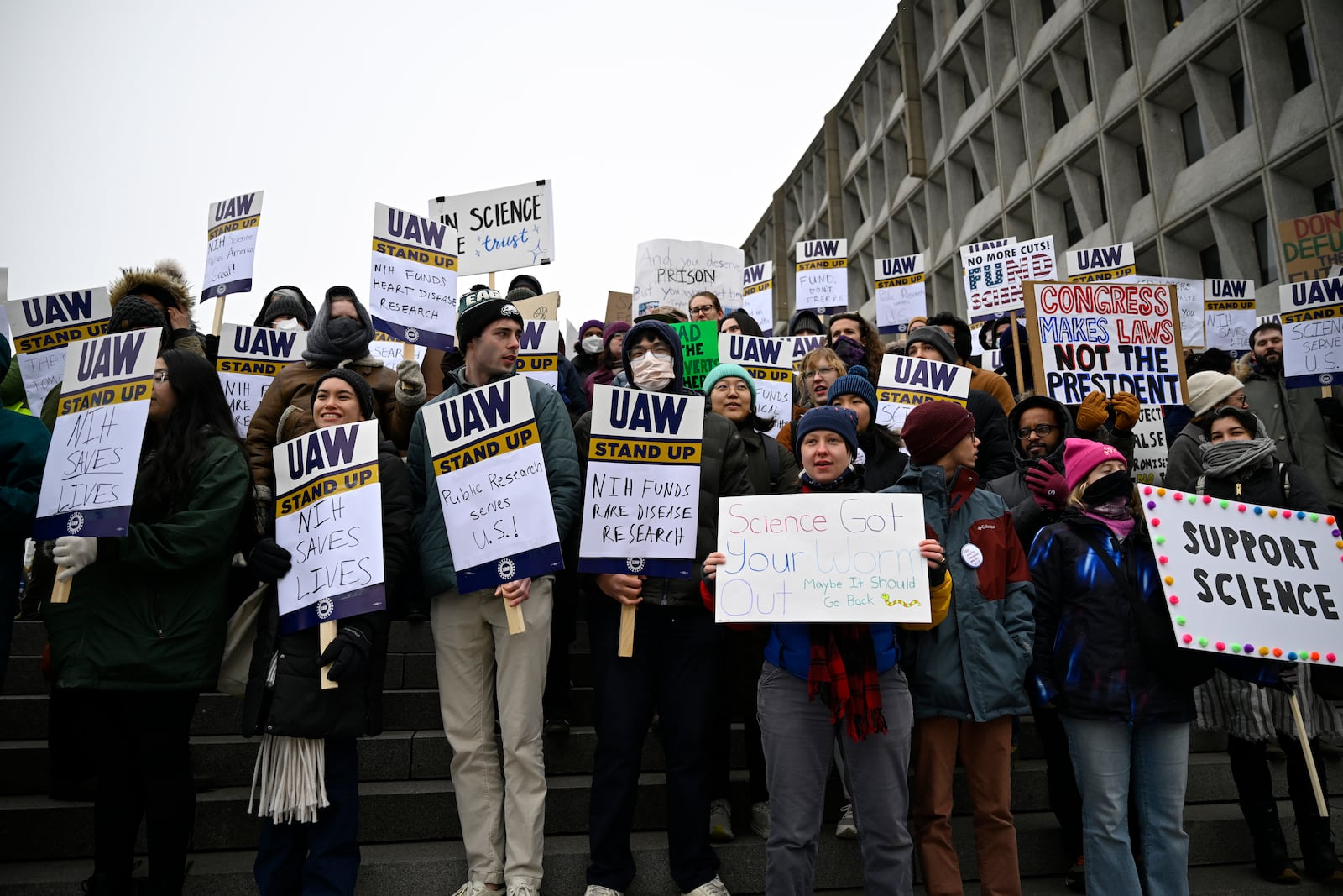 People rally at Health and Human Services headquarters to protest the polices of President Donald Trump and Elon Musk Wednesday, Feb. 19, 2025, in Washington. (AP Photo/John McDonnell)