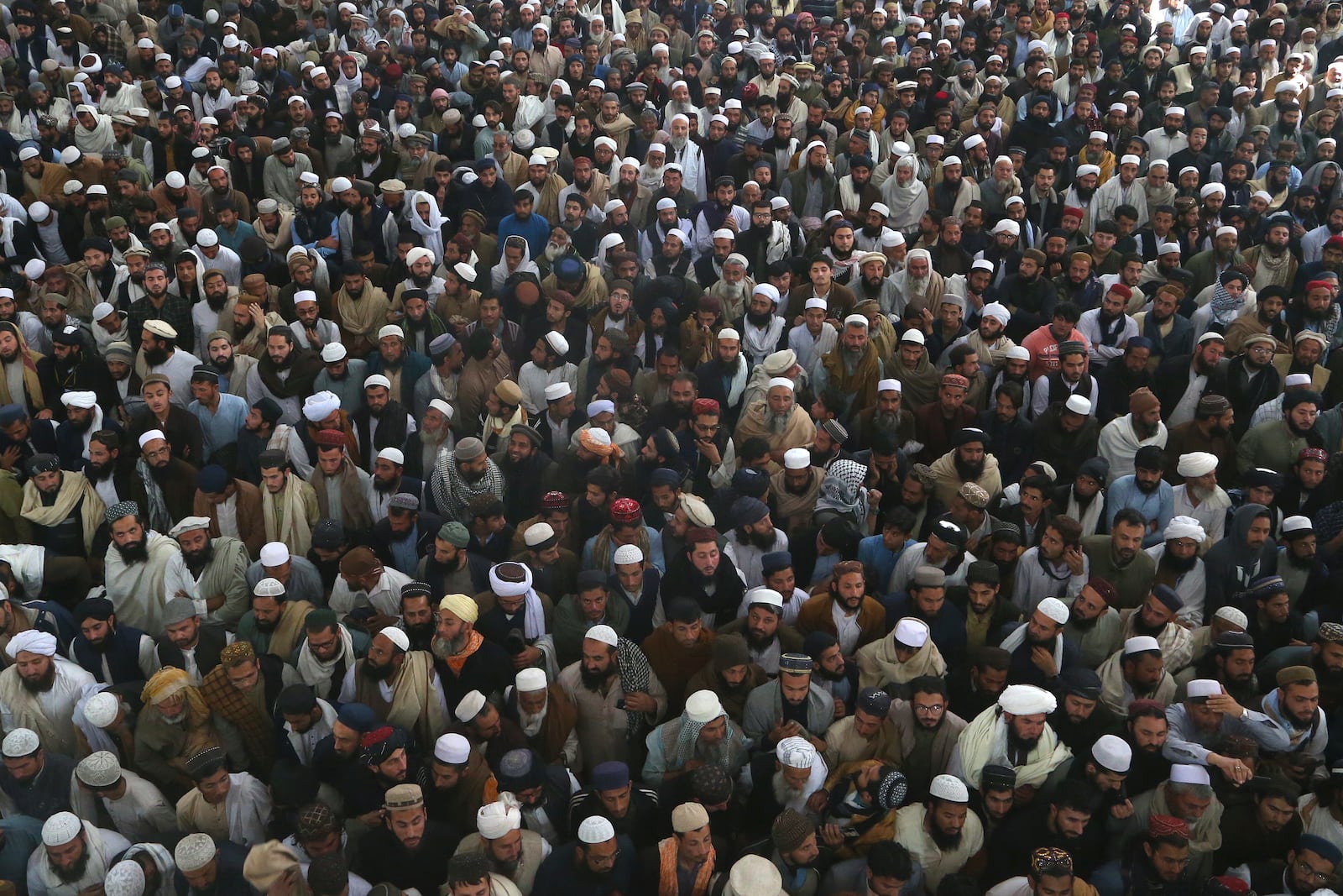 Mourners attend the funeral prayer of a senior Muslim cleric, Hamidul Haq who was killed in the Friday's suicide bomb attack at a pro-Taliban seminary in Akora Khattak, Pakistan, Saturday, March 1, 2025. (AP Photo/Muhammad Sajjad)