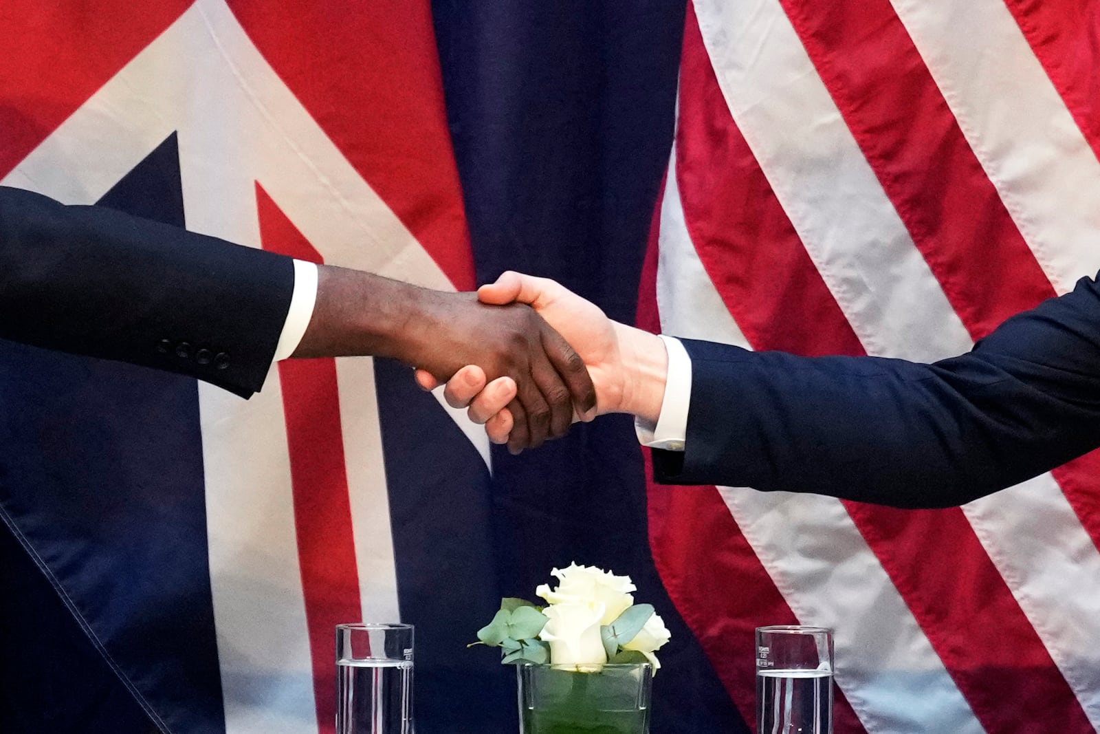 United States Vice-President JD Vance, right, and Britain's Foreign Secretary David Lammy shake hands during a bilateral meeting on the sidelines of the Munich Security Conference in Munich, Germany, Friday, Feb. 14, 2025. (AP Photo/Matthias Schrader)